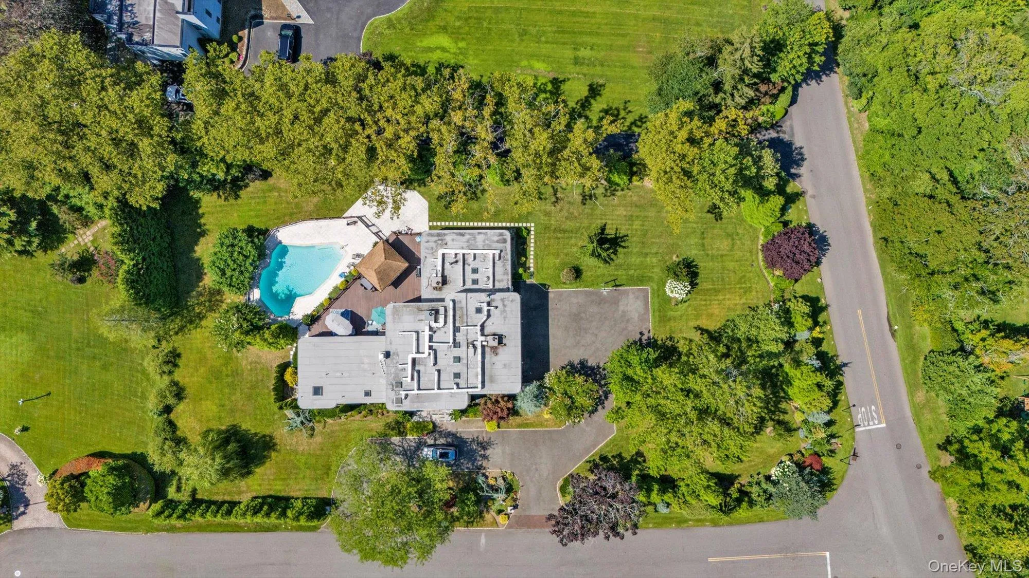 Aerial view of house with a pool area Aerial view of house with a pool area