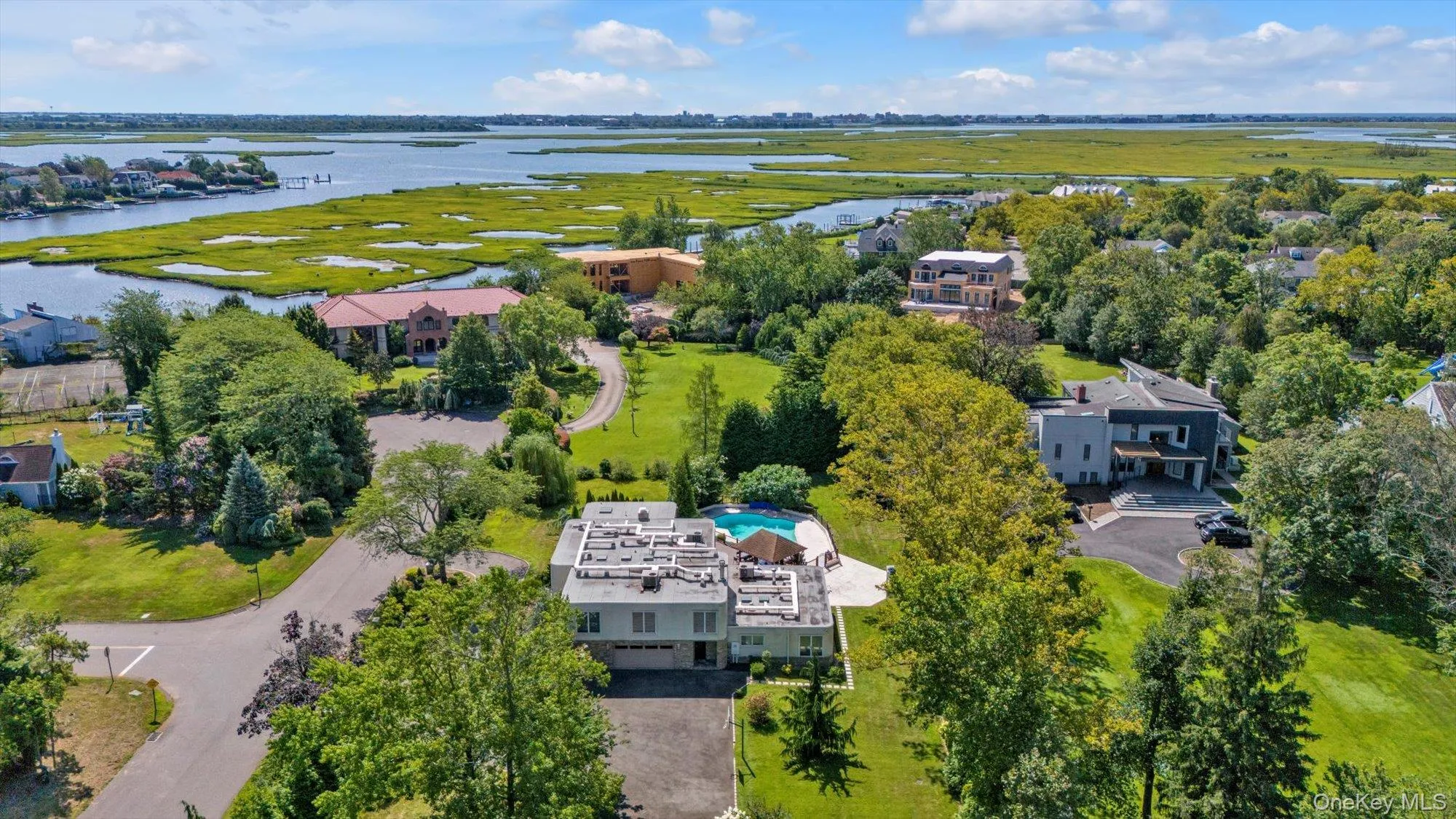 Aerial view of residential area with a nearby body of water Aerial view of residential area with a nearby body of water
