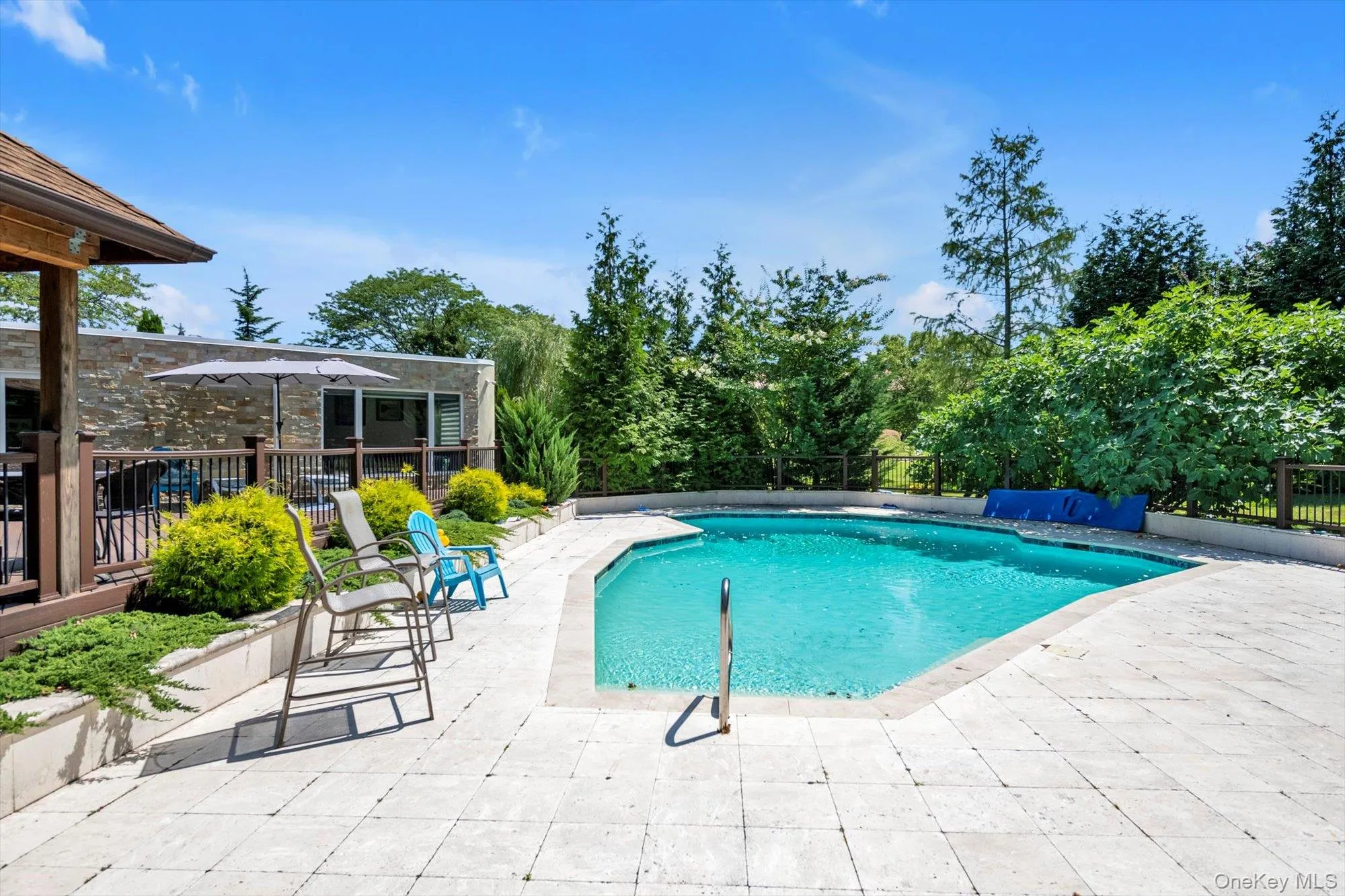 View of swimming pool featuring a patio View of swimming pool featuring a patio