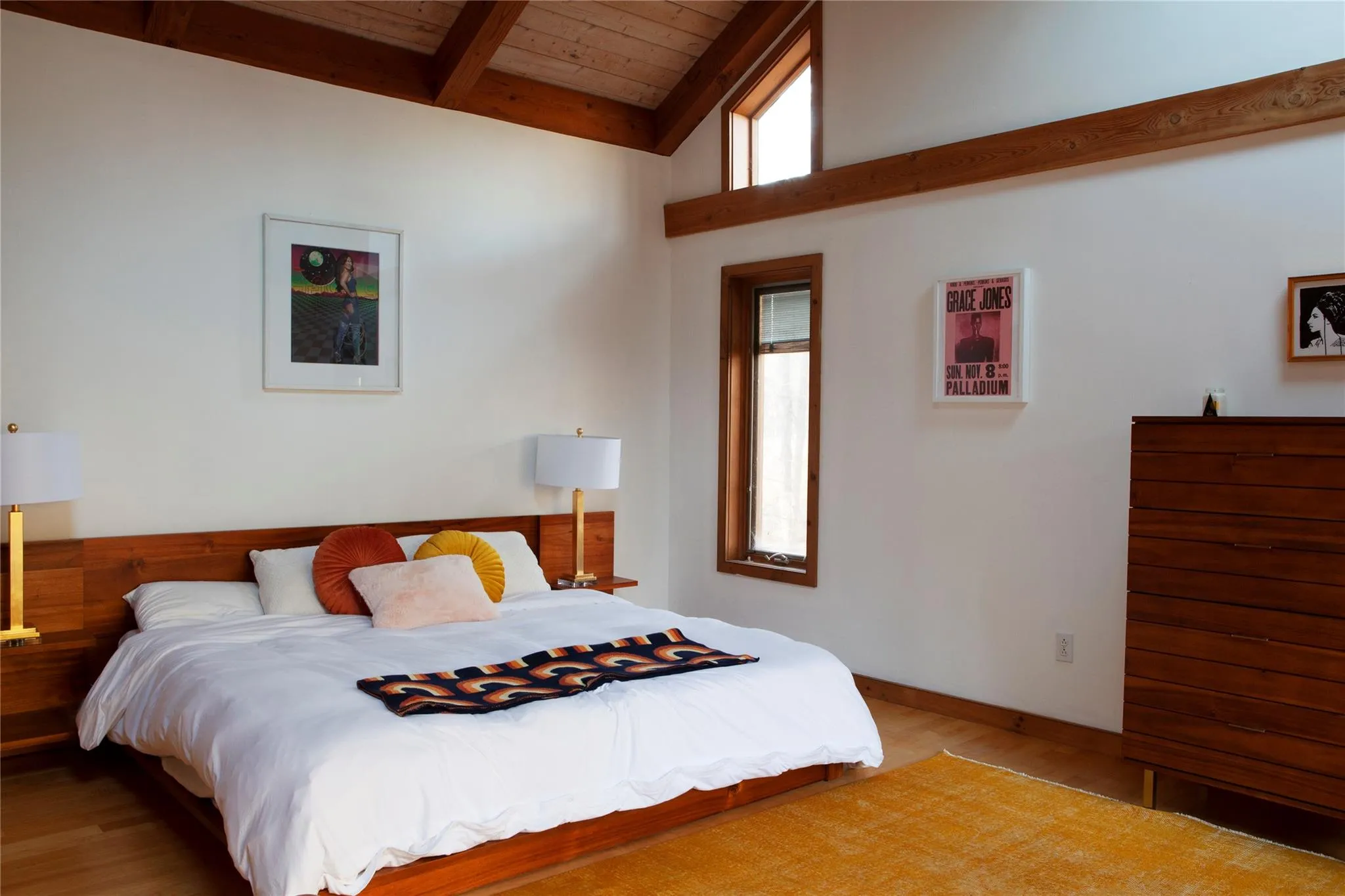 Bedroom with light wood finished floors and wooden ceiling Bedroom with light wood finished floors and wooden ceiling