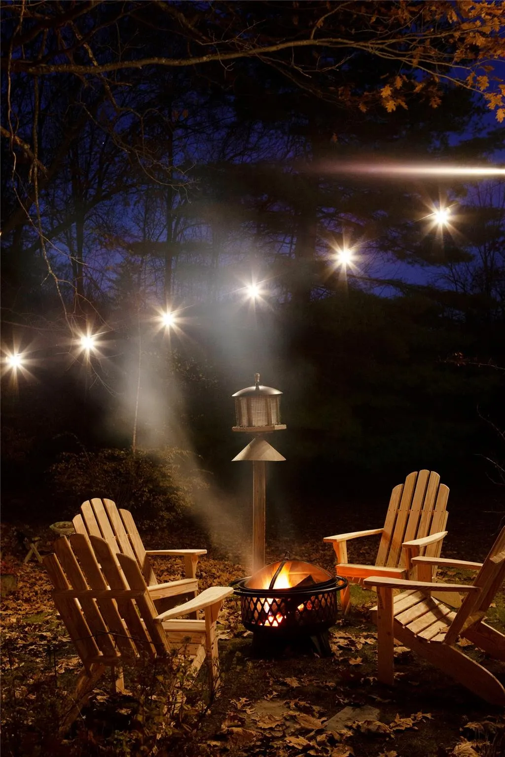 Yard at night with an outdoor fire pit Yard at night with an outdoor fire pit