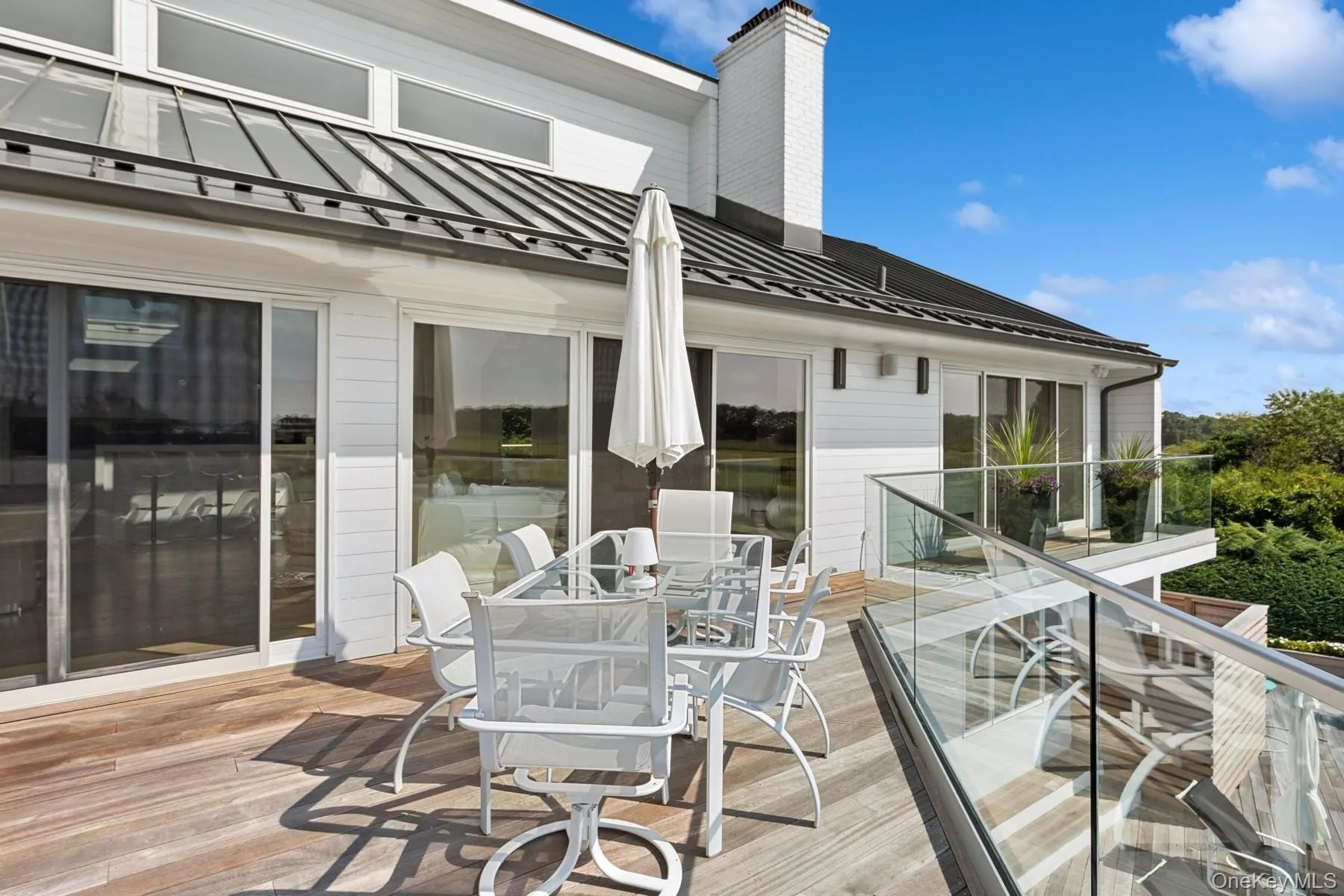 Wooden terrace with outdoor dining area Wooden terrace with outdoor dining area