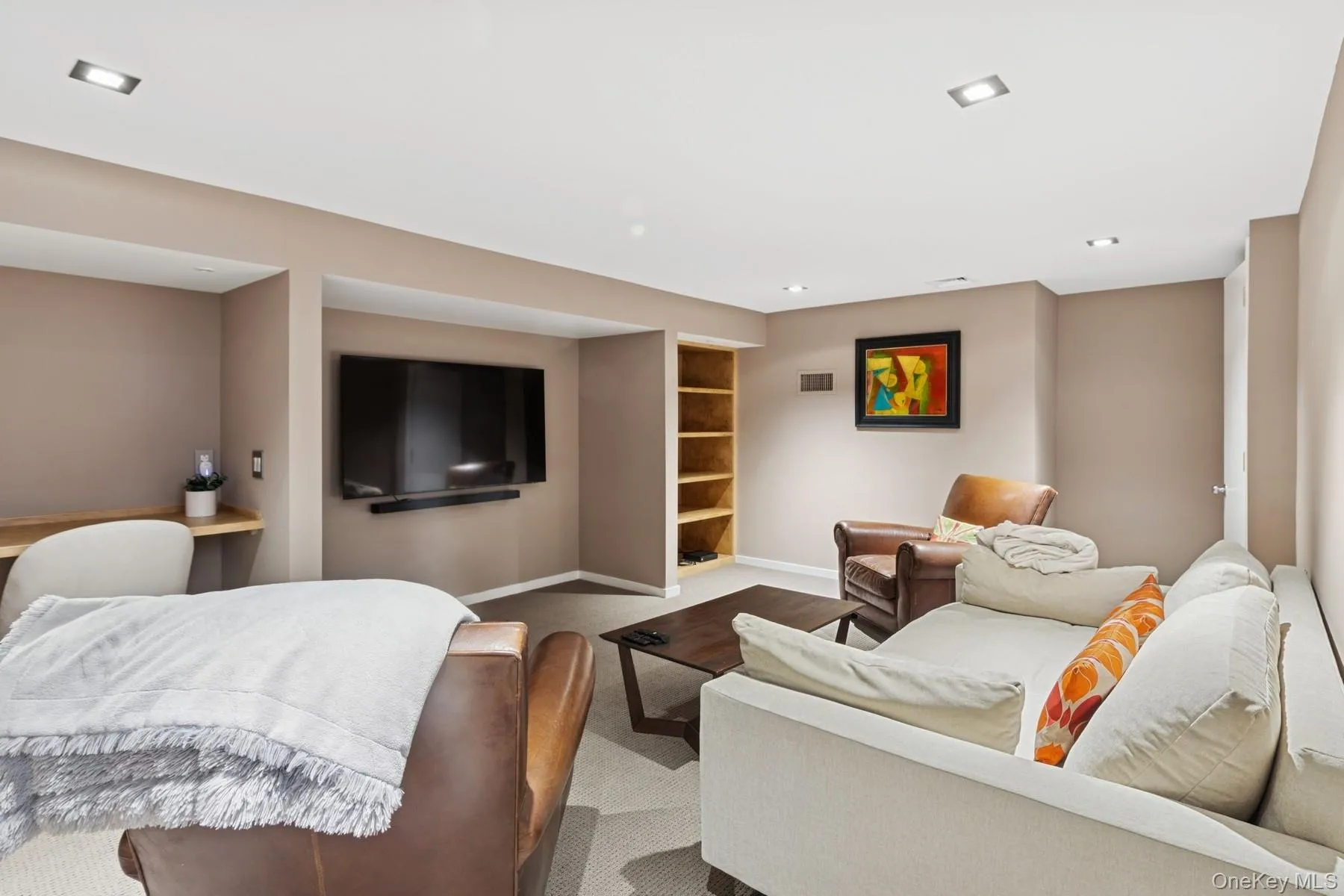 Living room featuring dark colored carpet and recessed lighting Living room featuring dark colored carpet and recessed lighting
