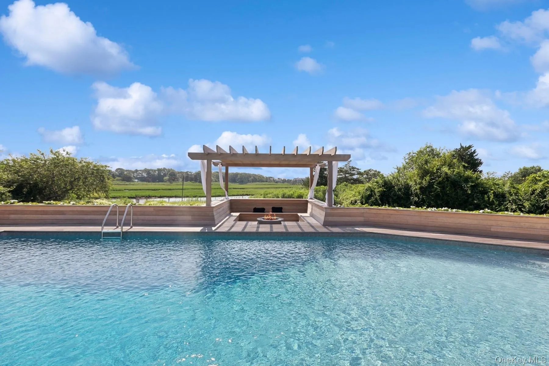 Outdoor pool featuring a pergola Outdoor pool featuring a pergola