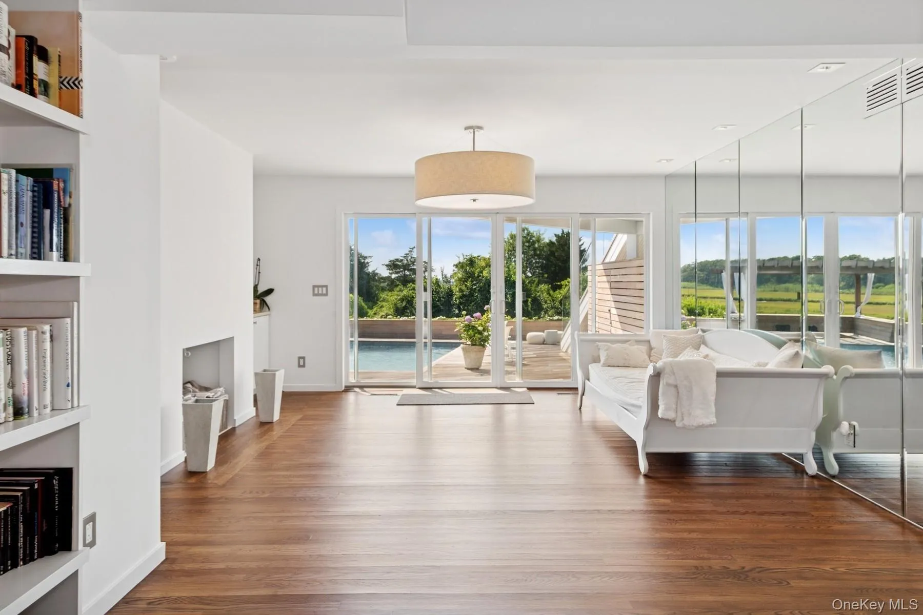 Sitting room featuring wood finished floors and baseboards Sitting room featuring wood finished floors and baseboards