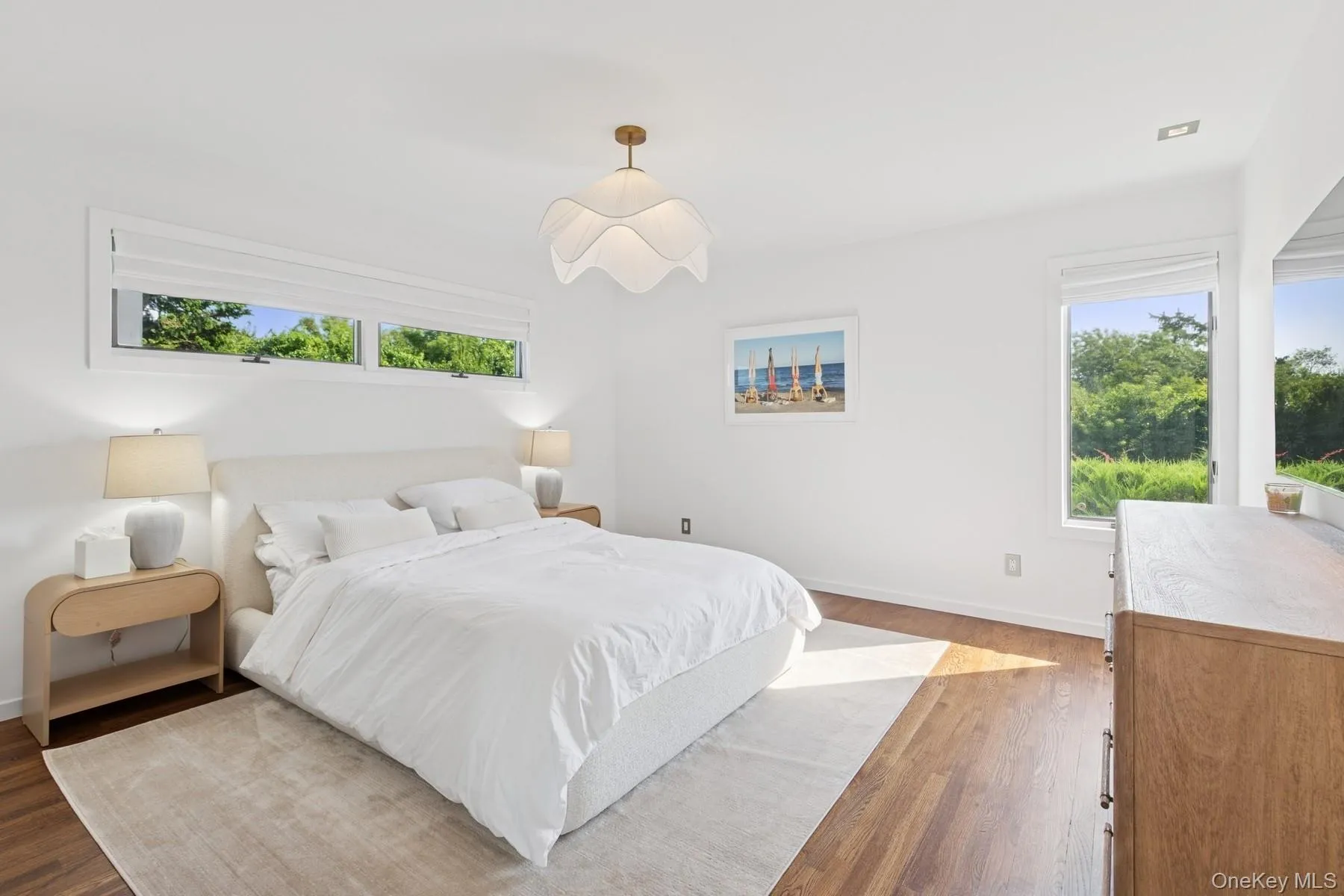 Bedroom with wood finished floors and baseboards Bedroom with wood finished floors and baseboards