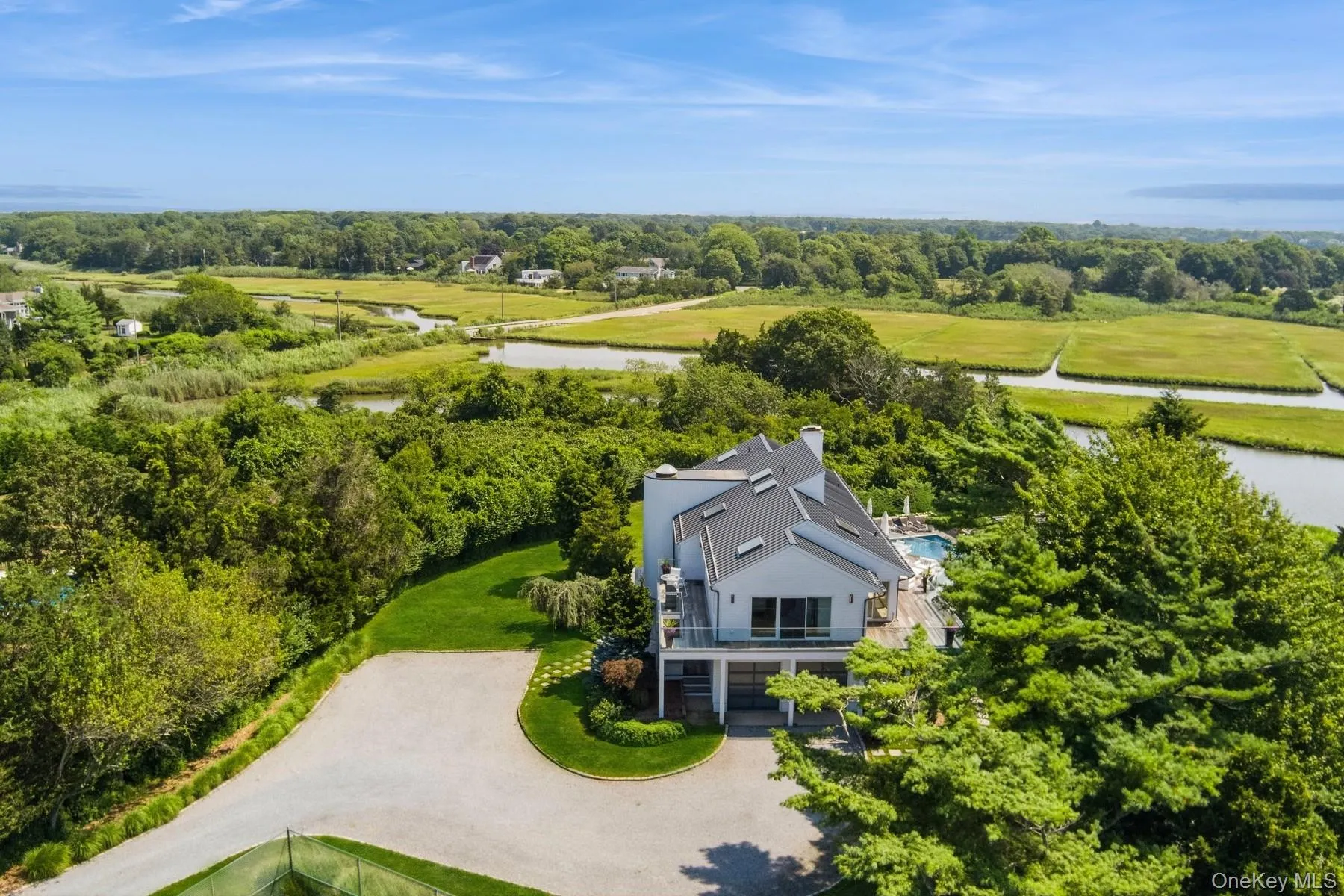 View of subject property featuring a nearby body of water View of subject property featuring a nearby body of water
