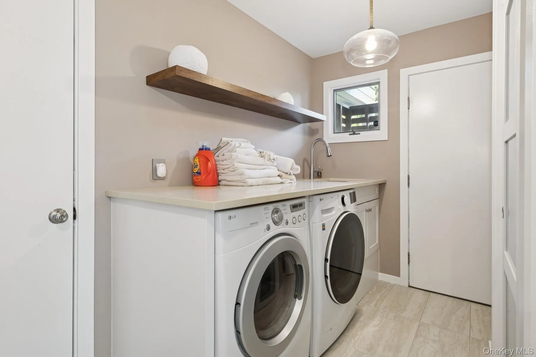 Laundry area featuring washer and clothes dryer Laundry area featuring washer and clothes dryer
