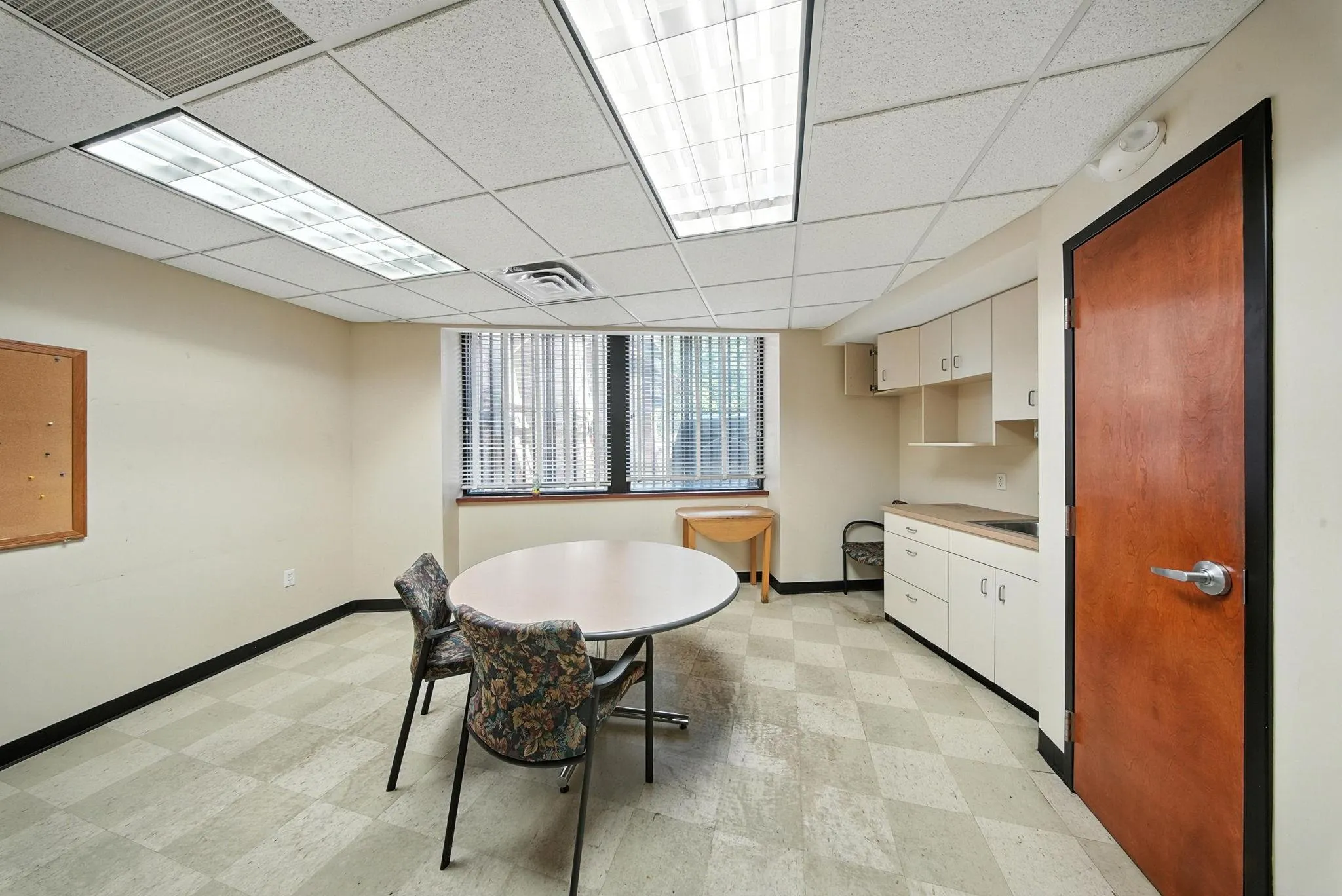Dining room featuring a paneled ceiling and light flooring Dining room featuring a paneled ceiling and light flooring