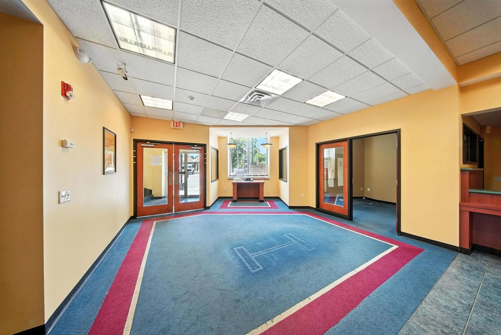 Rec room featuring french doors, a paneled ceiling, and carpet floors Rec room featuring french doors, a paneled ceiling, and carpet floors