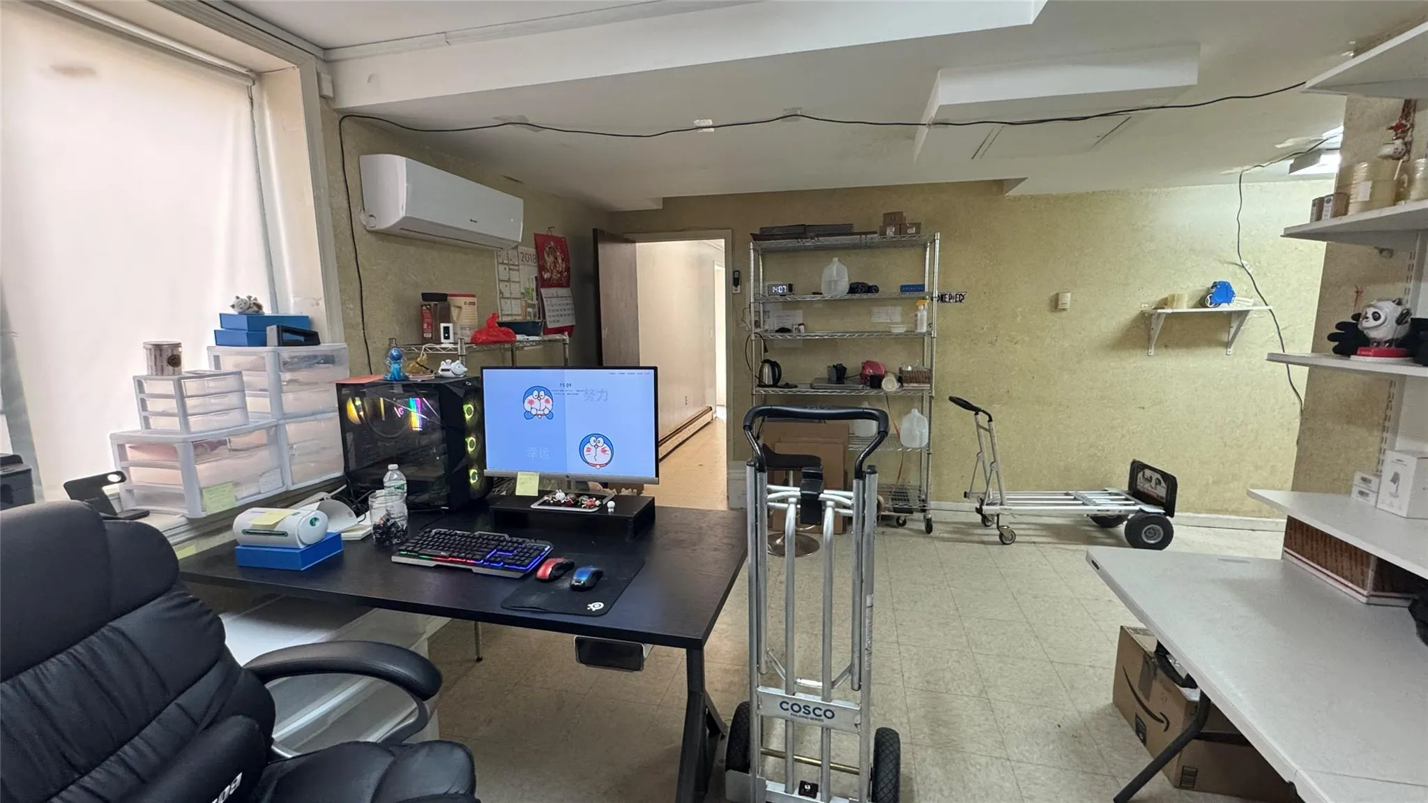 Office featuring an AC wall unit and tile patterned floors Office featuring an AC wall unit and tile patterned floors