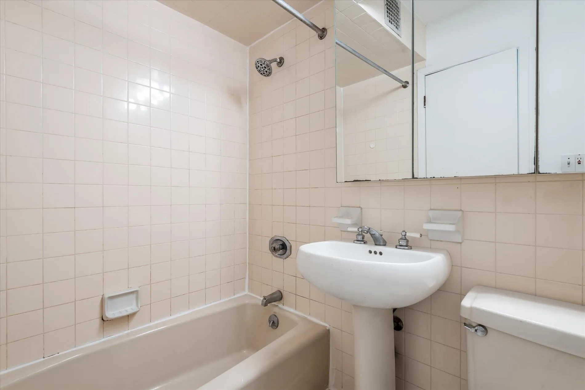 Full bathroom with tile walls, shower / tub combination, and backsplash Full bathroom with tile walls, shower / tub combination, and backsplash