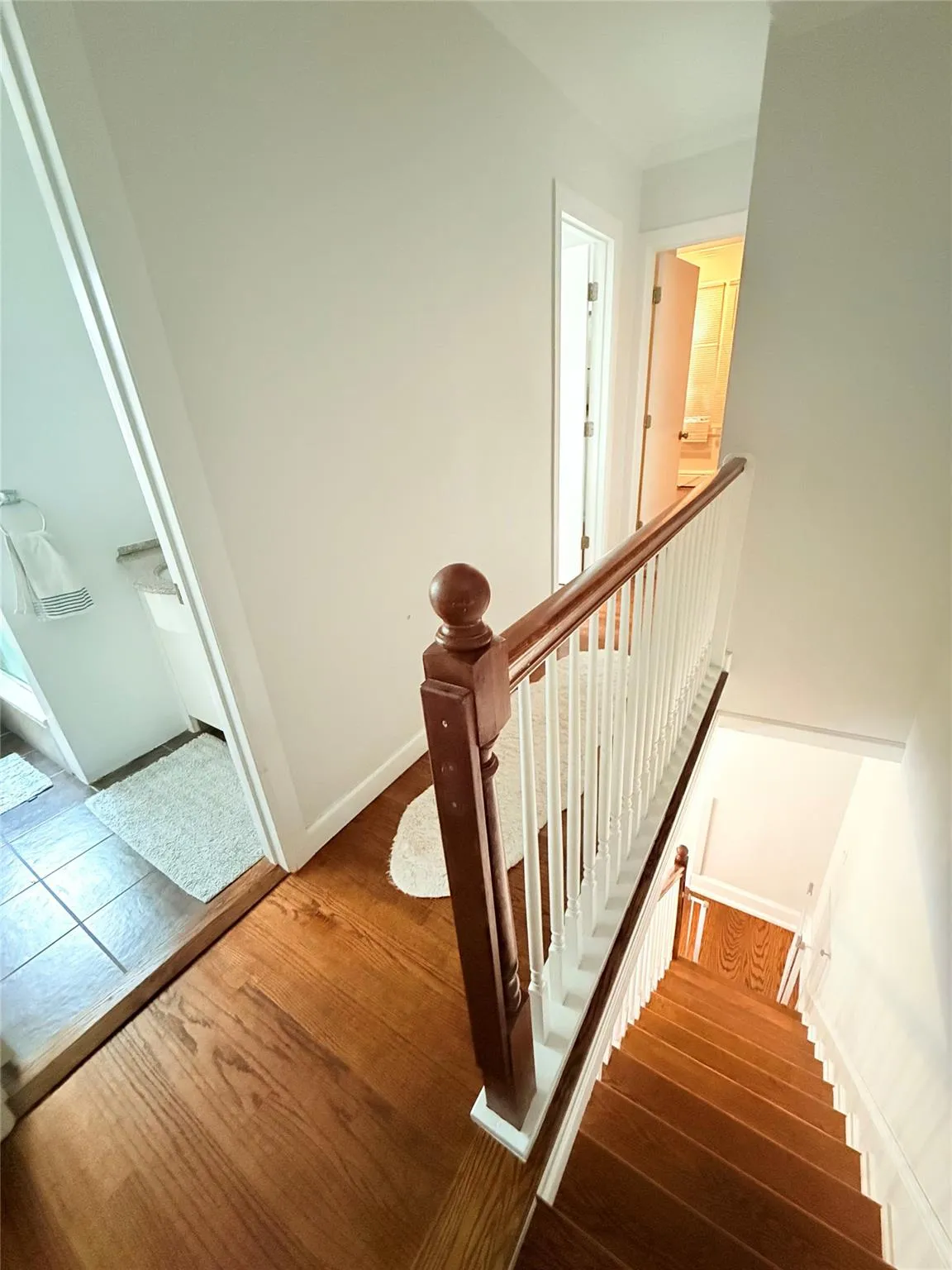 Staircase with wood finished floors and baseboards Staircase with wood finished floors and baseboards
