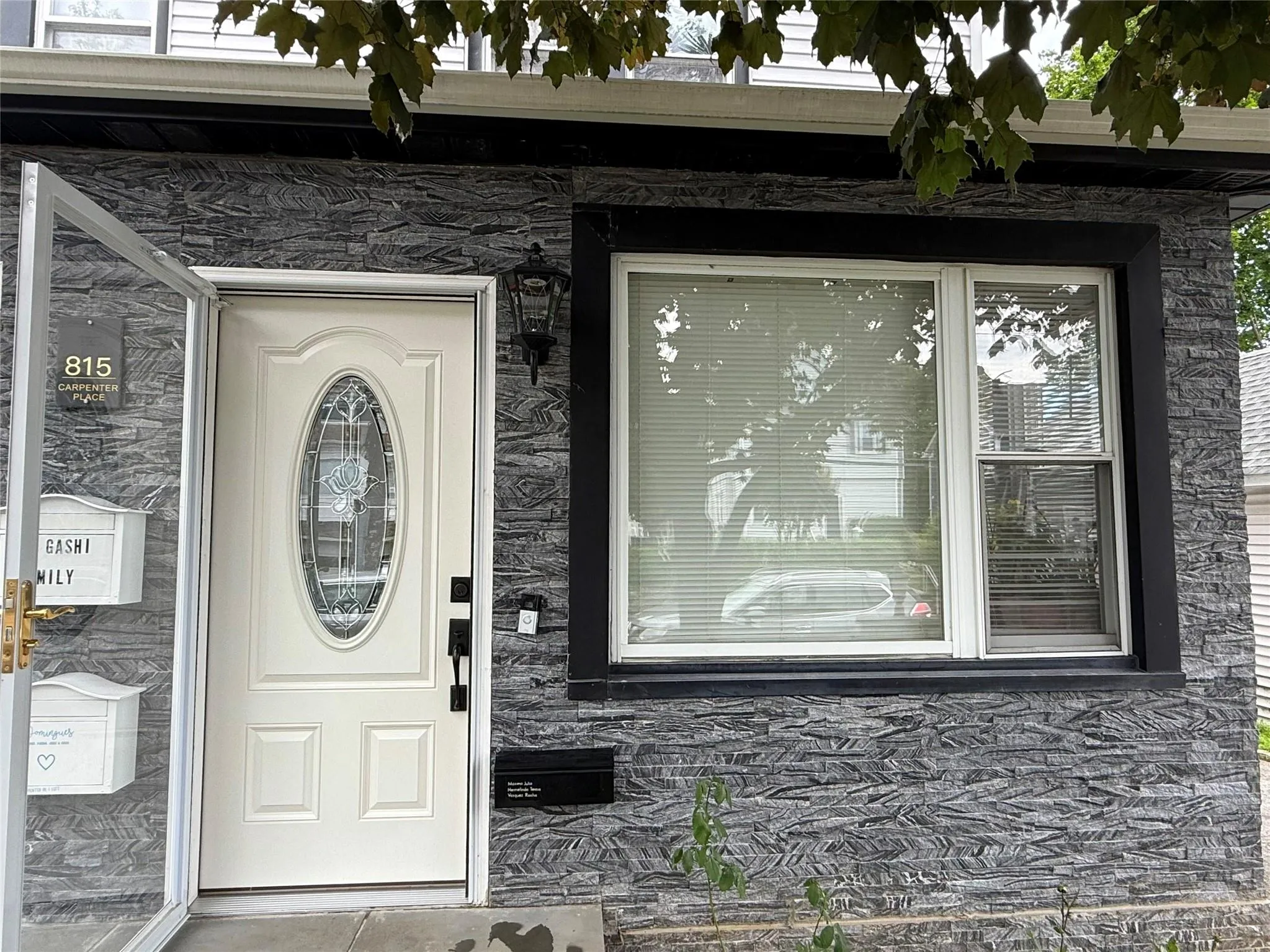 View of exterior entry featuring stone siding View of exterior entry featuring stone siding