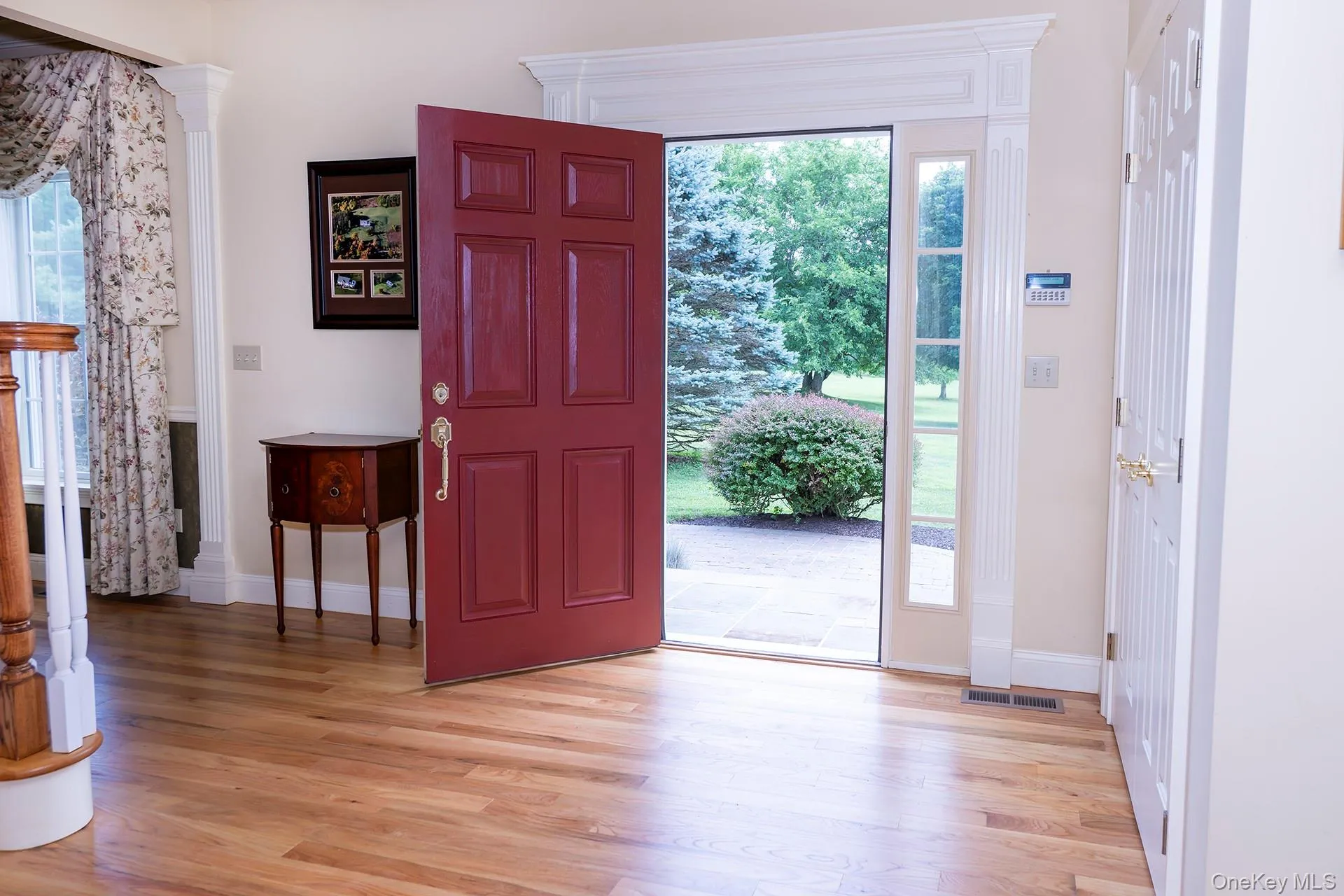 Entrance foyer featuring light wood-type flooring Entrance foyer featuring light wood-type flooring