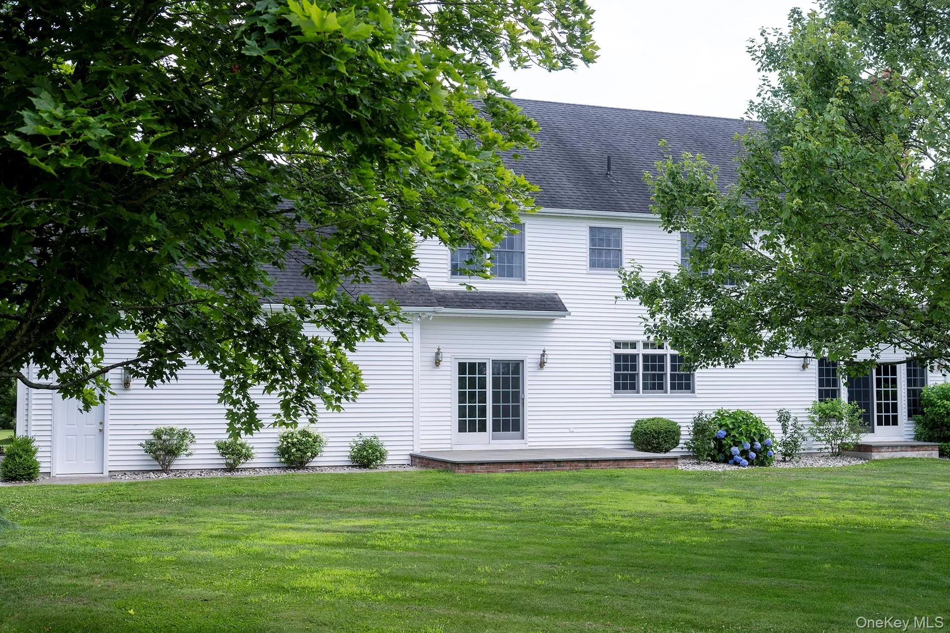 Rear view of house with a private, level yard Rear view of house with a private, level yard