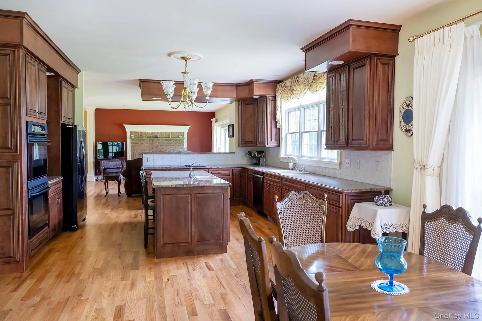 Spacious kitchen with island and dining area Spacious kitchen with island and dining area