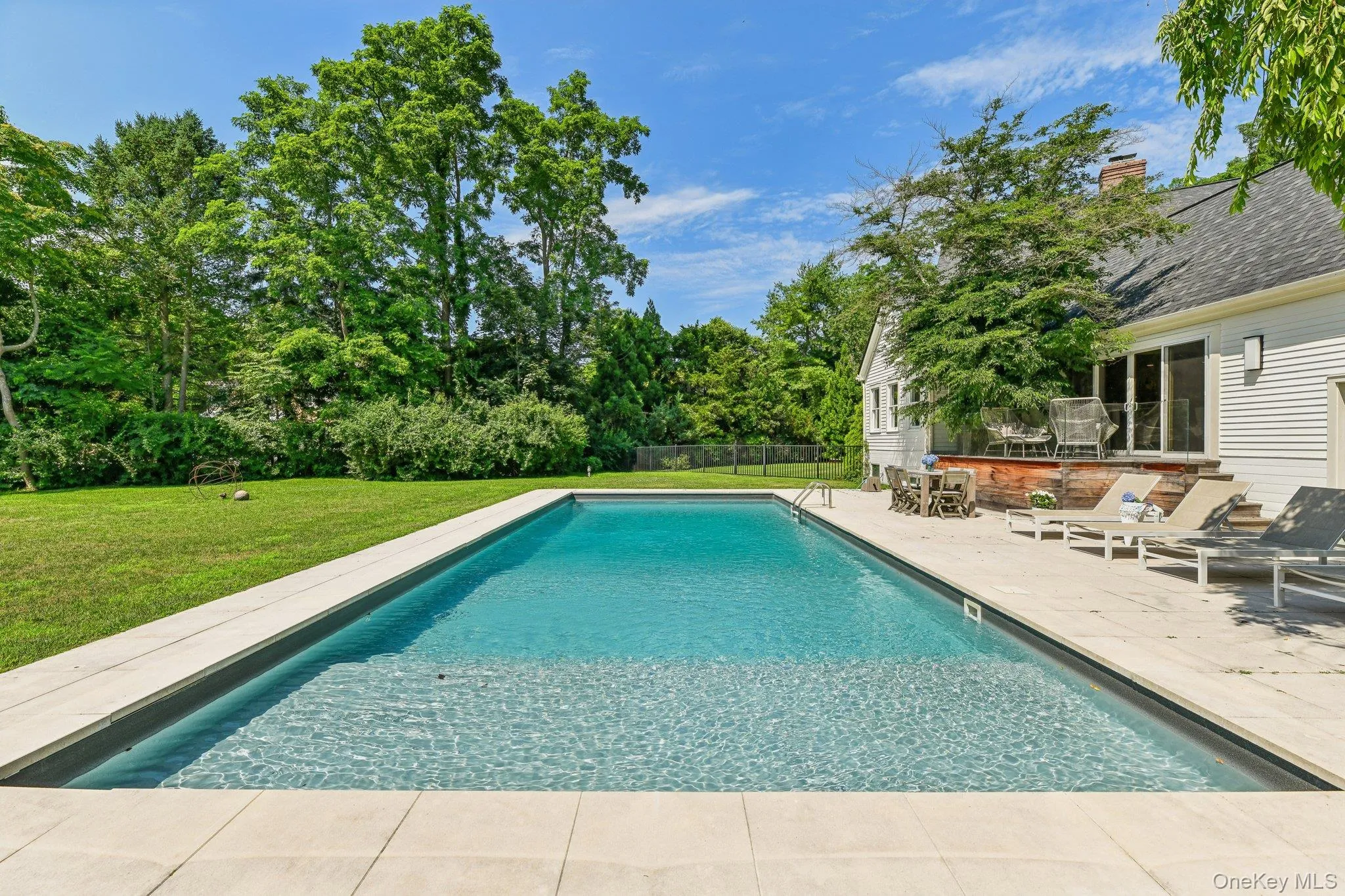 Swimming pool featuring a patio Swimming pool featuring a patio