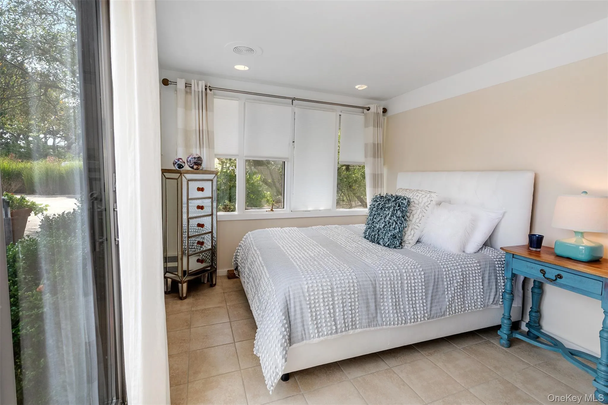 Bedroom featuring light tile patterned floors and recessed lighting Bedroom featuring light tile patterned floors and recessed lighting