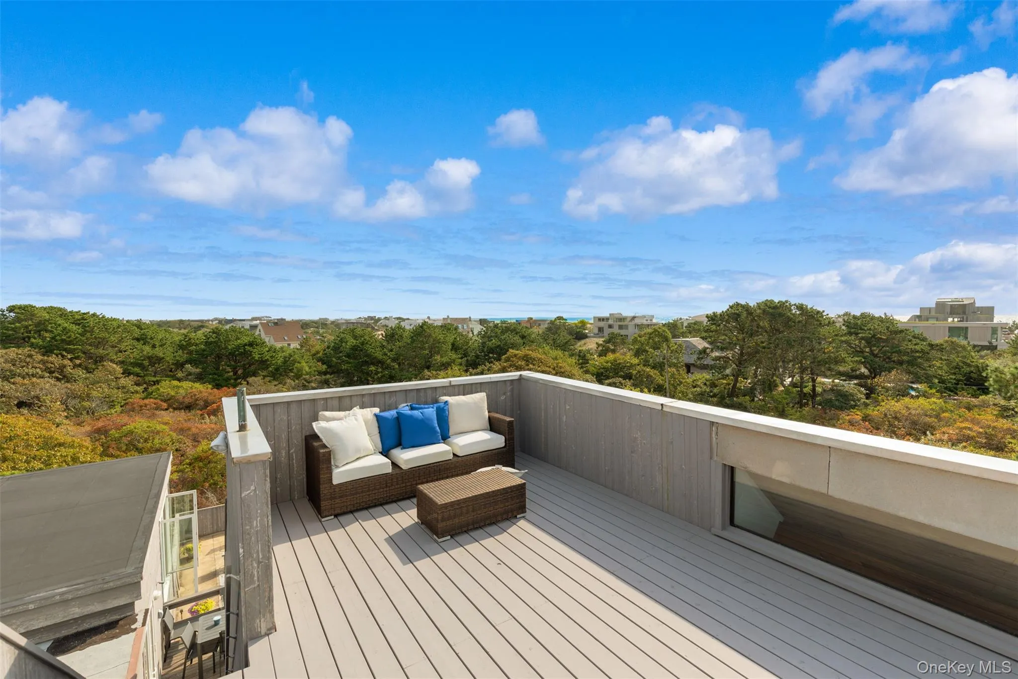 Deck with an outdoor living space Deck with an outdoor living space