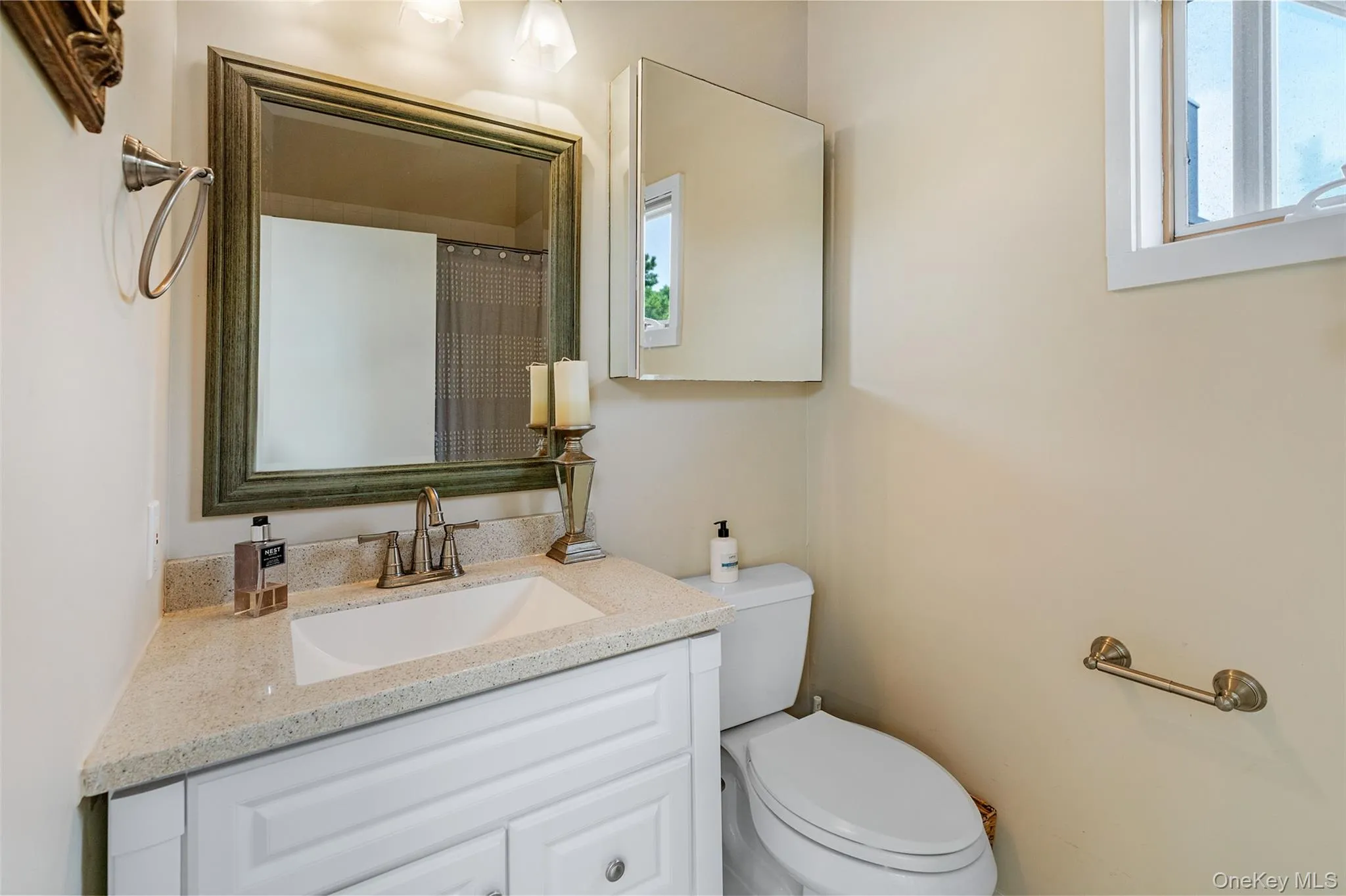 Full bathroom with toilet and vanity Full bathroom with toilet and vanity
