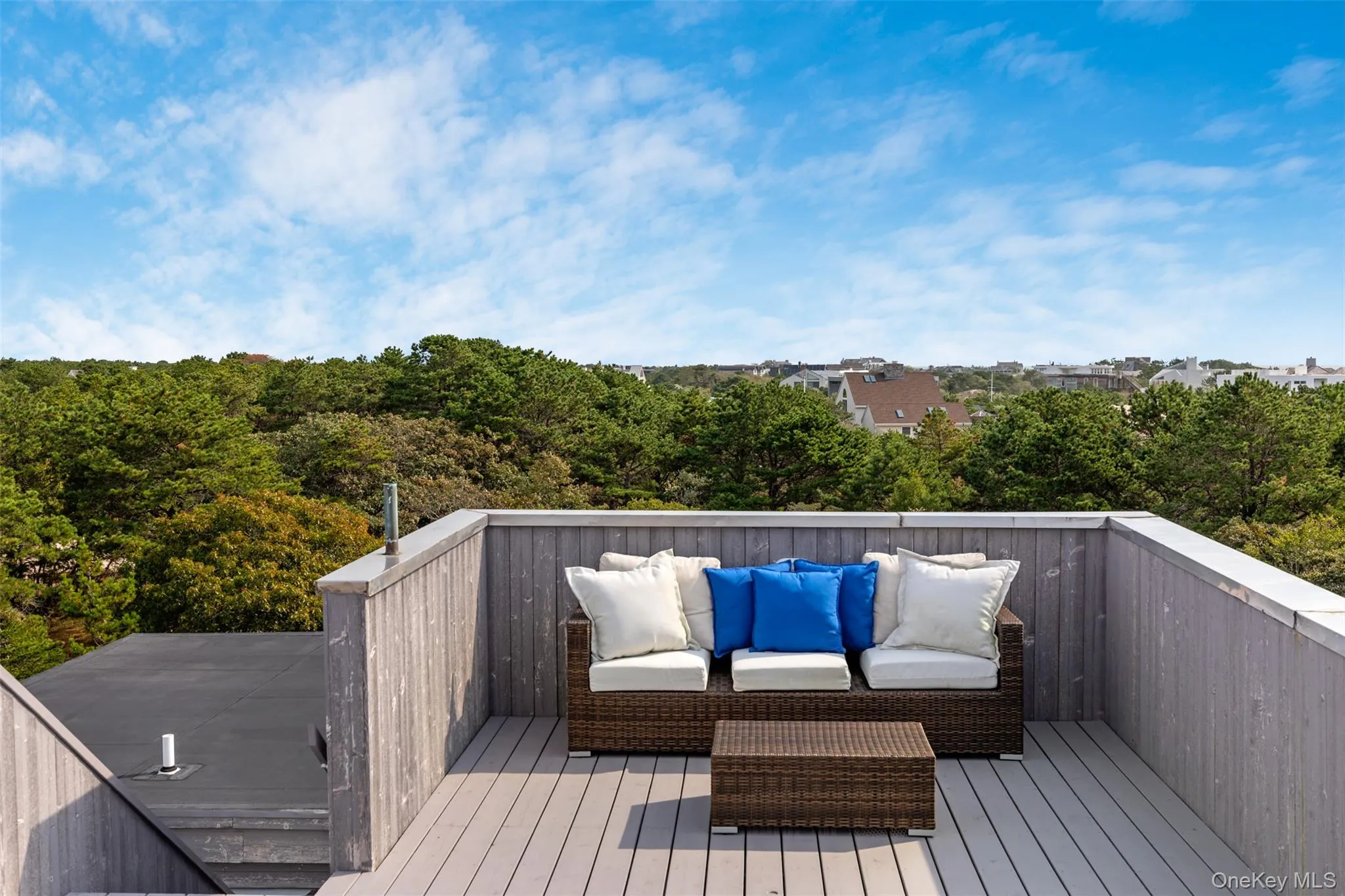 Wooden terrace featuring an outdoor hangout area Wooden terrace featuring an outdoor hangout area