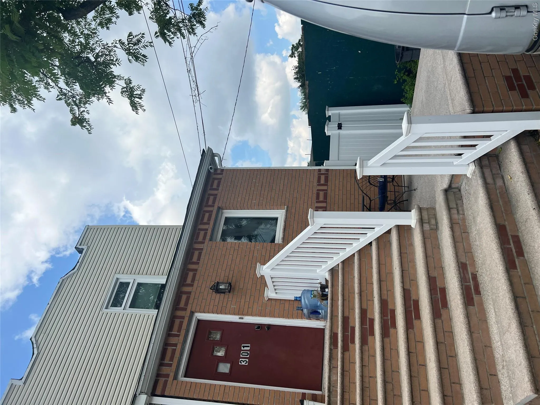 Property entrance with brick siding Property entrance with brick siding