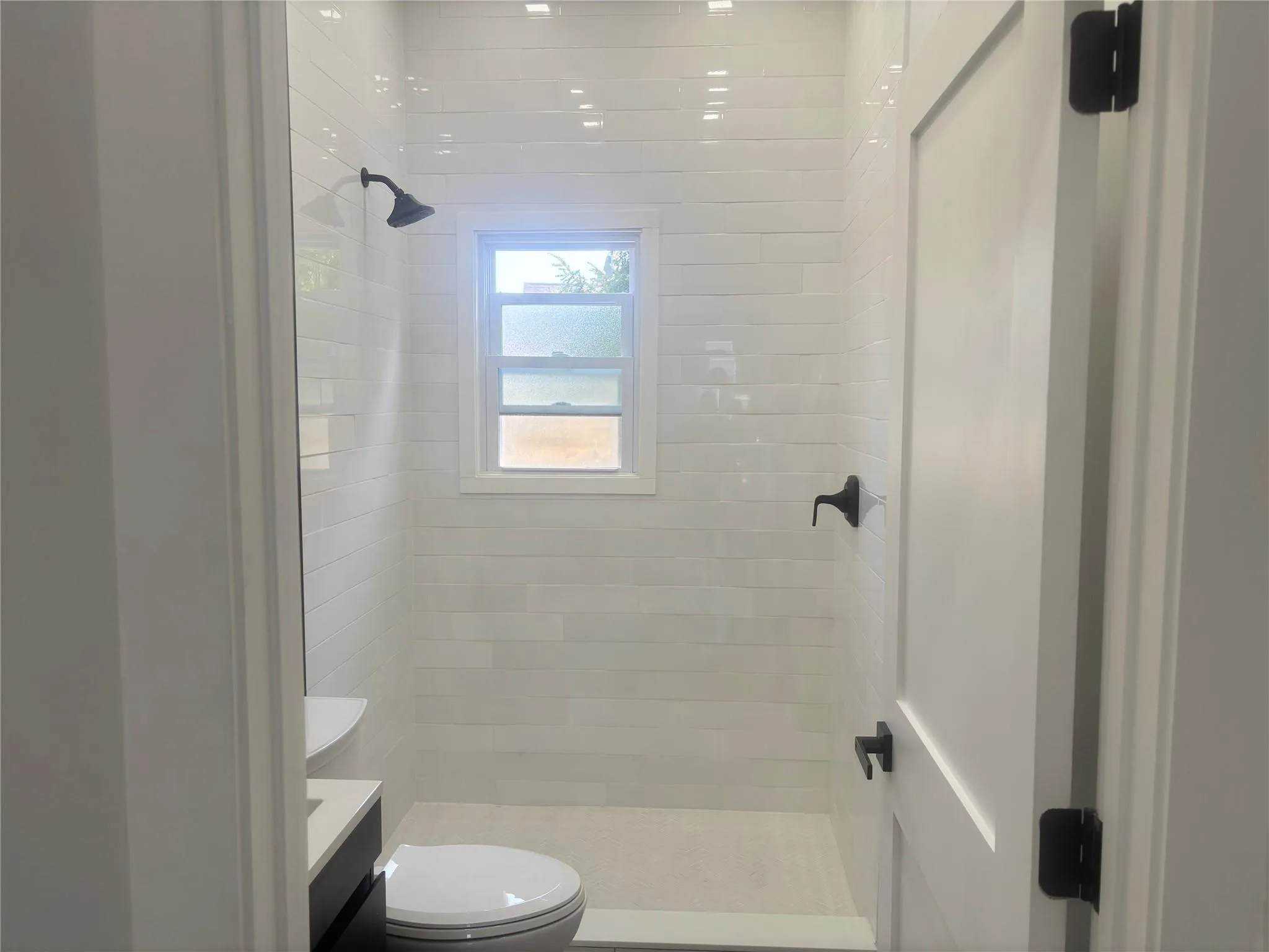 Full bathroom with a shower stall and vanity Full bathroom with a shower stall and vanity