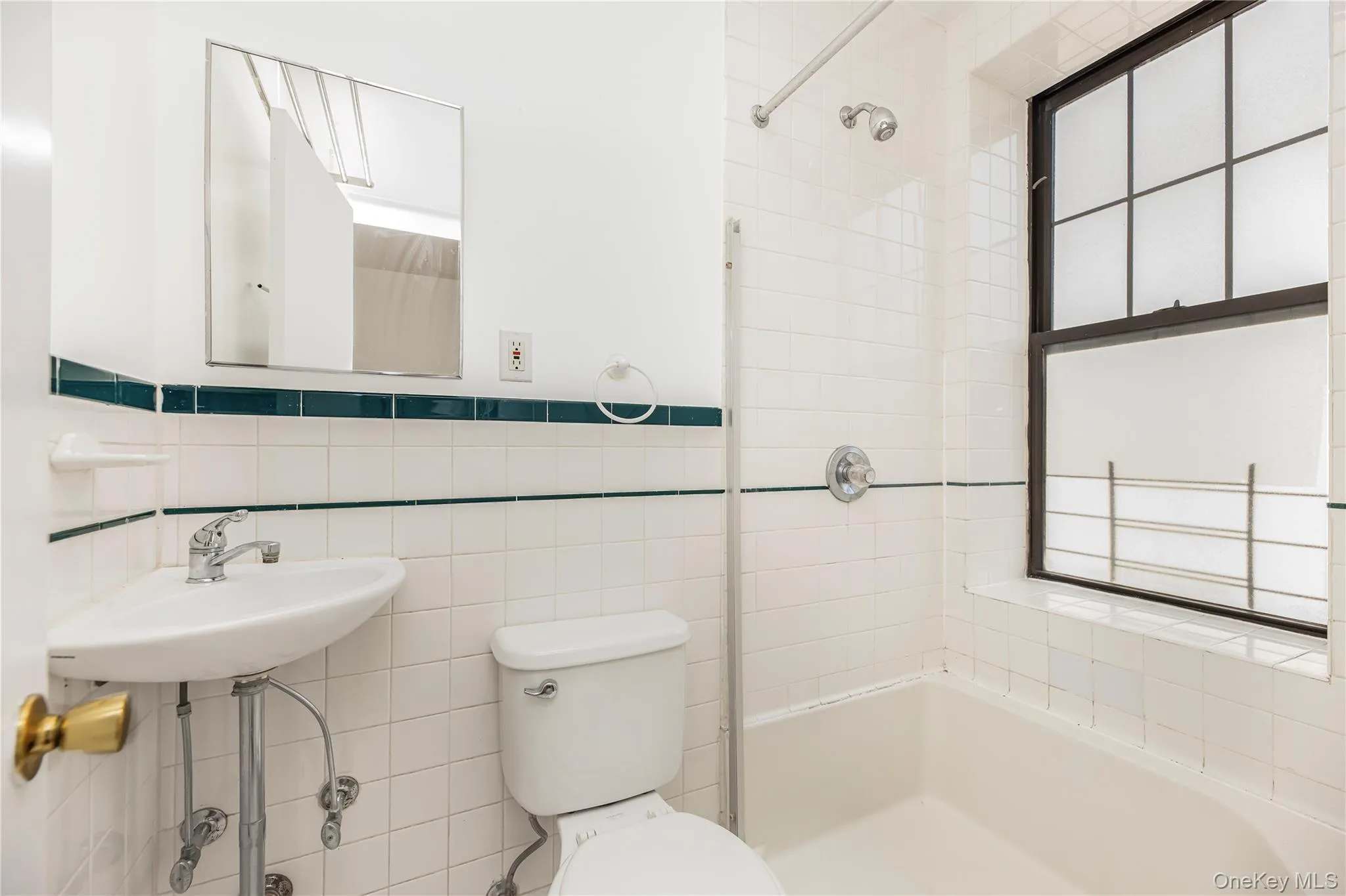 Full bathroom featuring tile walls and a shower Full bathroom featuring tile walls and a shower