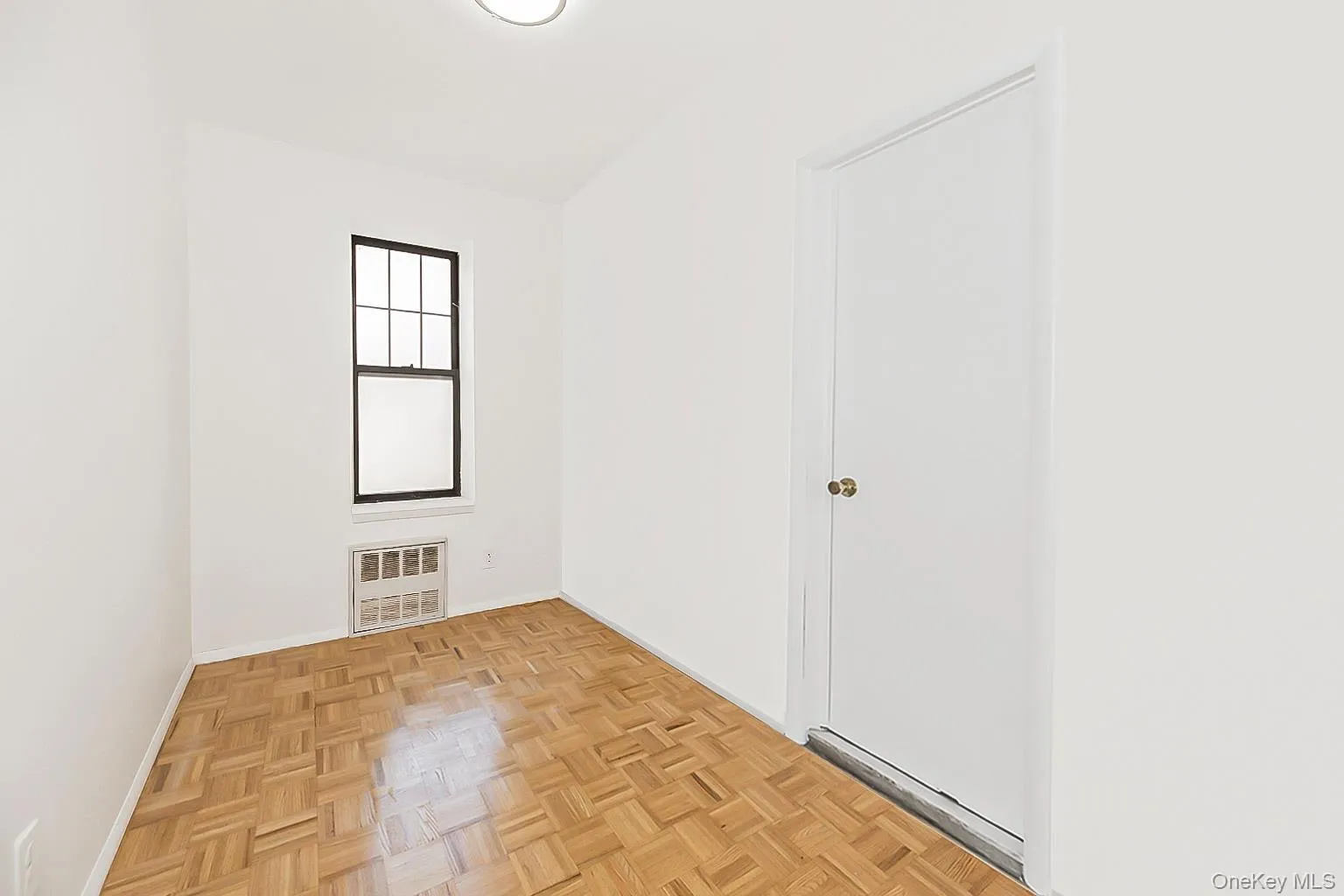 Unfurnished room with baseboards Unfurnished room with baseboards