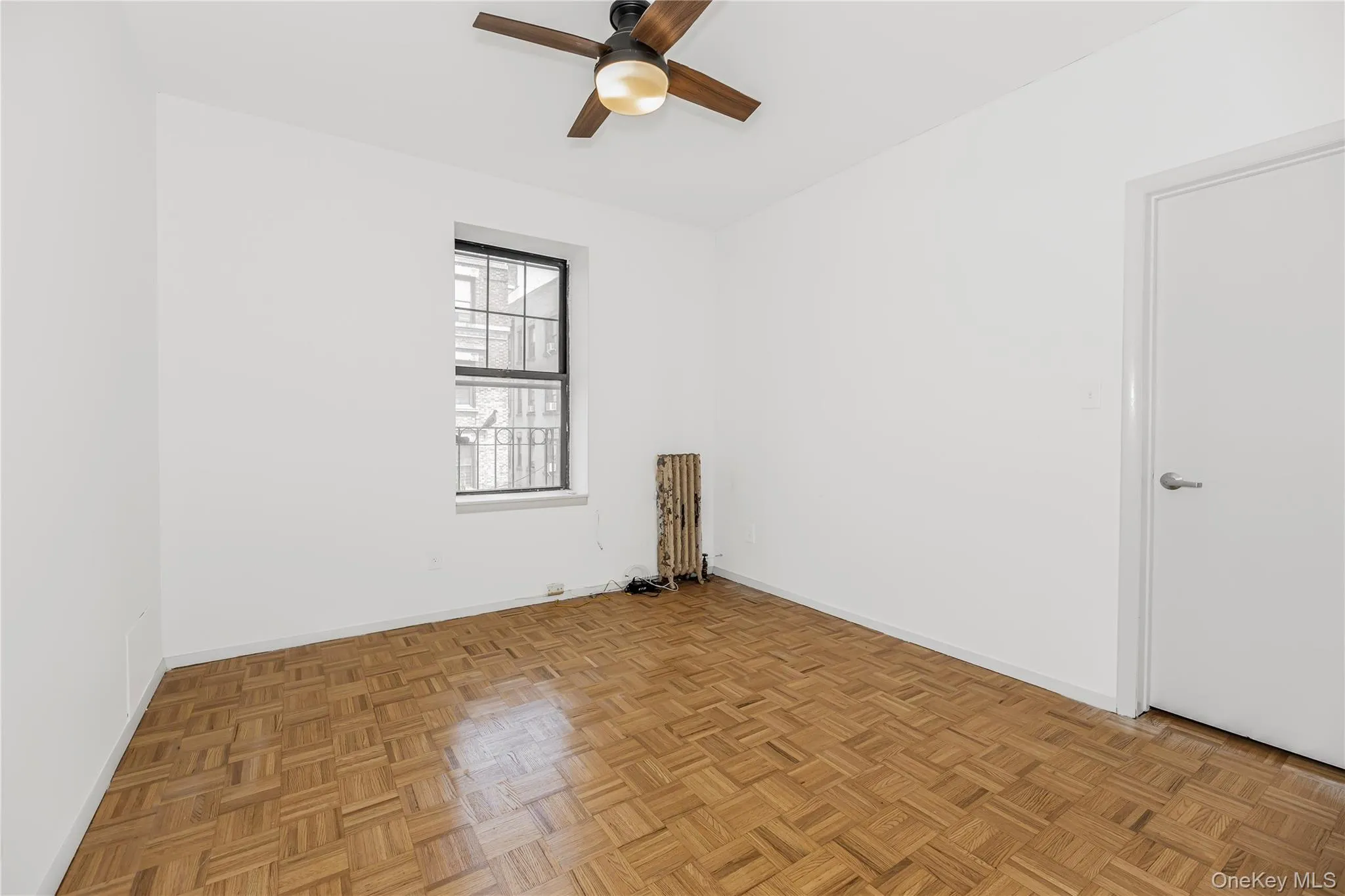 Empty room with baseboards and ceiling fan Empty room with baseboards and ceiling fan