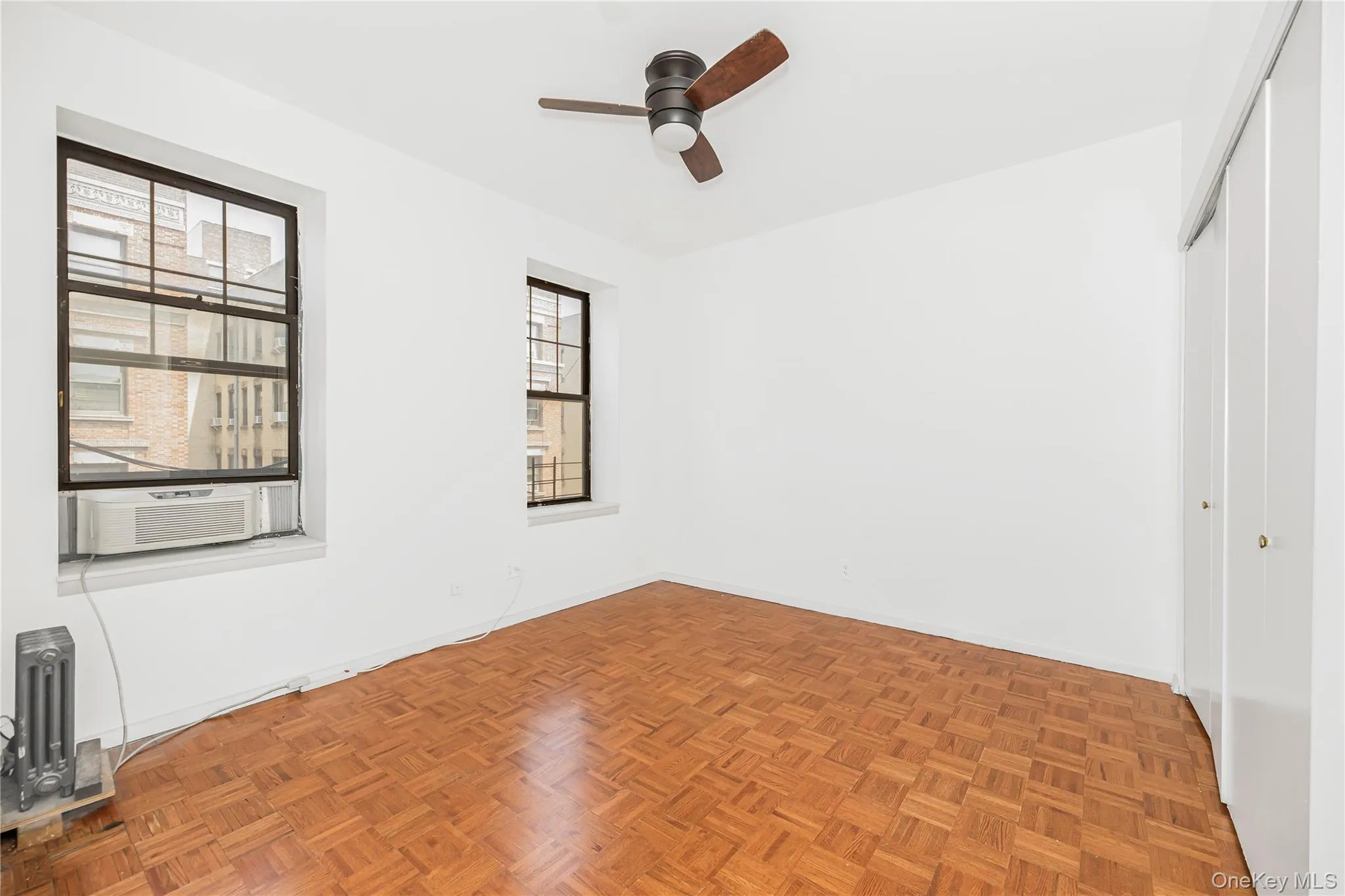 Unfurnished bedroom featuring a closet and a ceiling fan Unfurnished bedroom featuring a closet and a ceiling fan