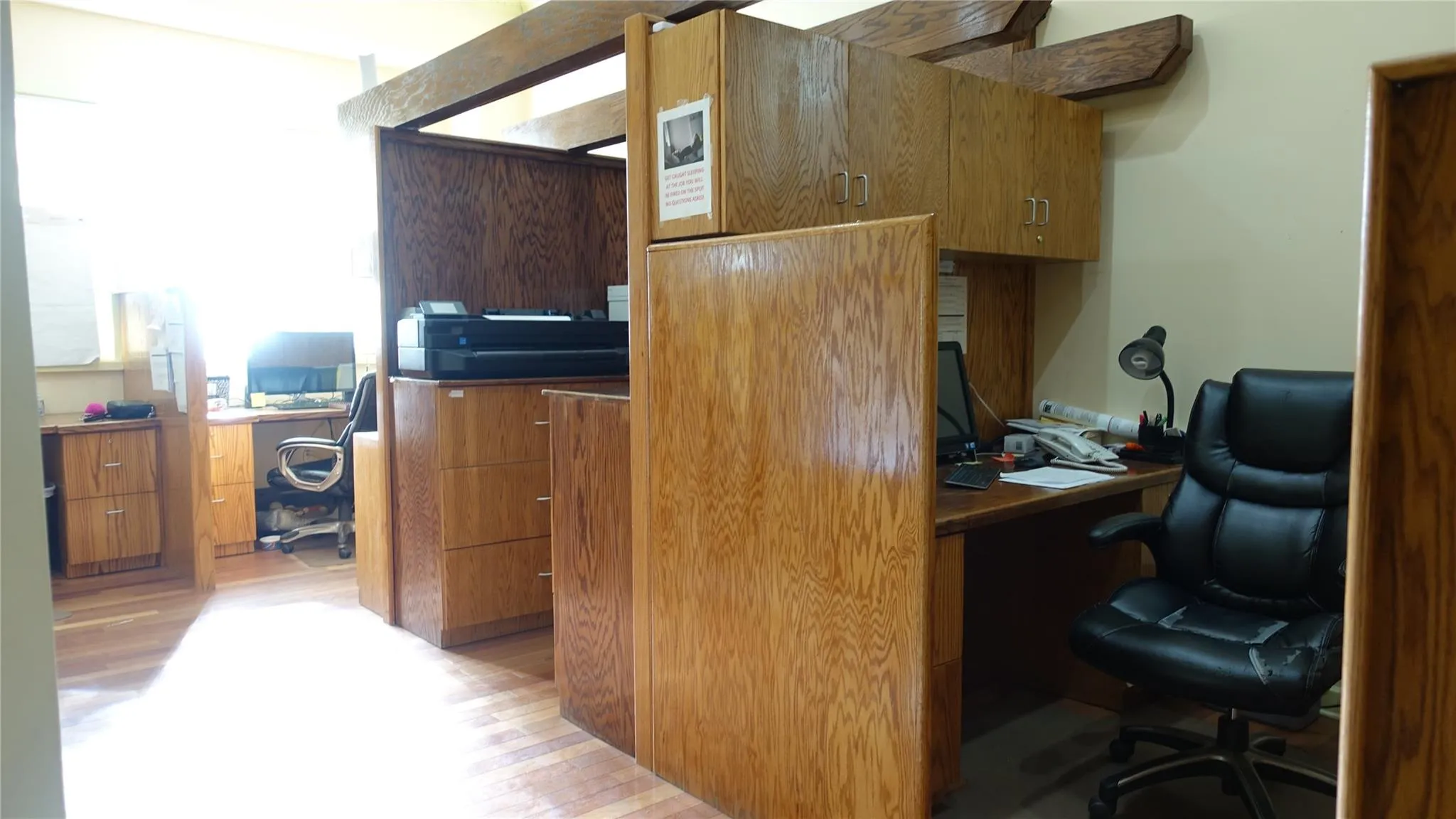 Home office featuring light wood-style floors Home office featuring light wood-style floors