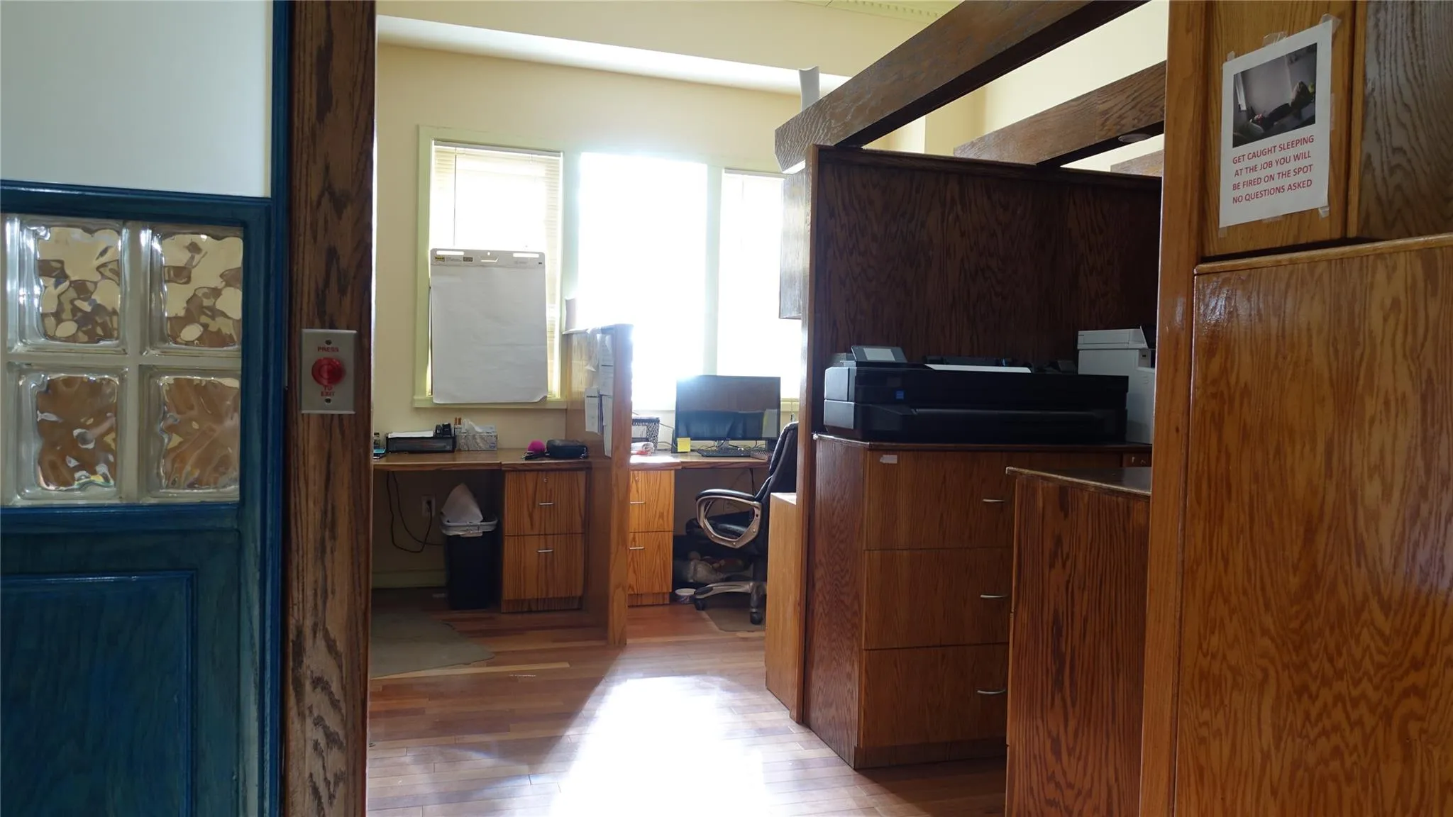 Office space featuring wood finished floors Office space featuring wood finished floors