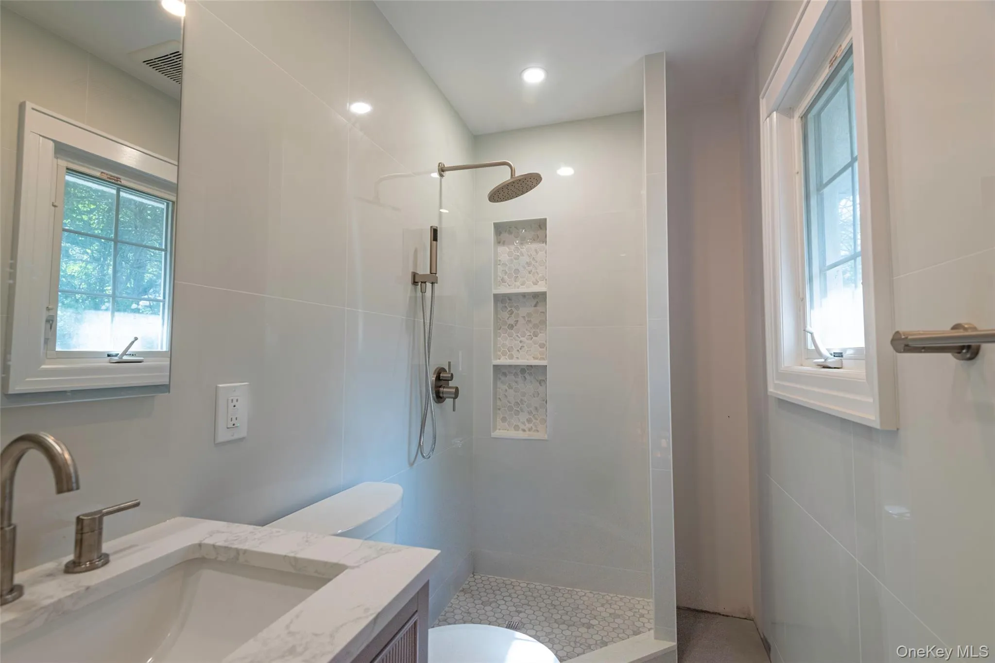 Full bathroom with vanity, a walk in shower, and recessed lighting Full bathroom with vanity, a walk in shower, and recessed lighting