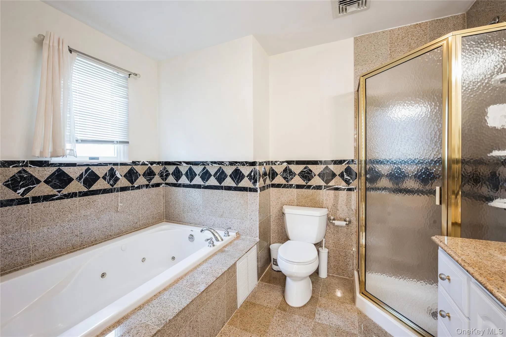 Another look at the gorgeous primary bathroom with the whirlpool tub and walk-in shower. Another look at the gorgeous primary bathroom with the whirlpool tub and walk-in shower.