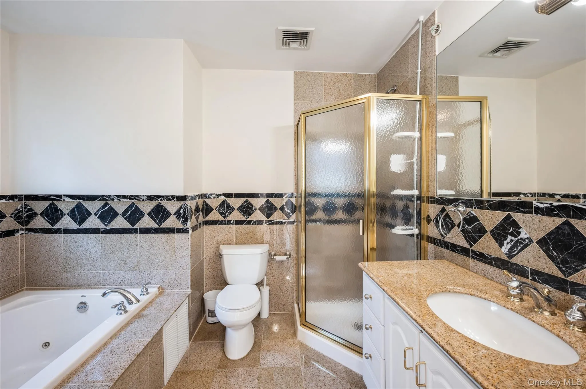 Gorgeous, en-suite  primary bathroom with walk-in shower and a whirlpool tub. Gorgeous, en-suite  primary bathroom with walk-in shower and a whirlpool tub.