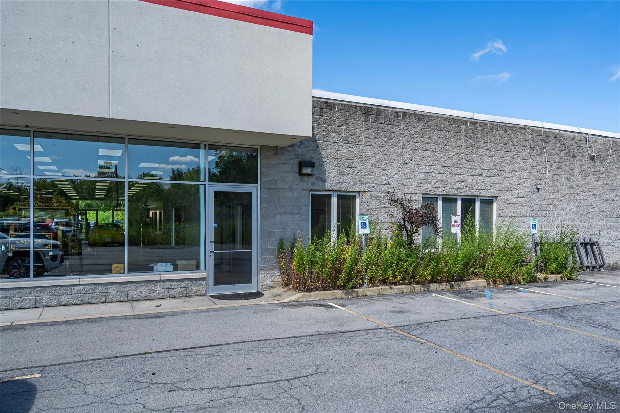 Doorway to property with uncovered parking Doorway to property with uncovered parking