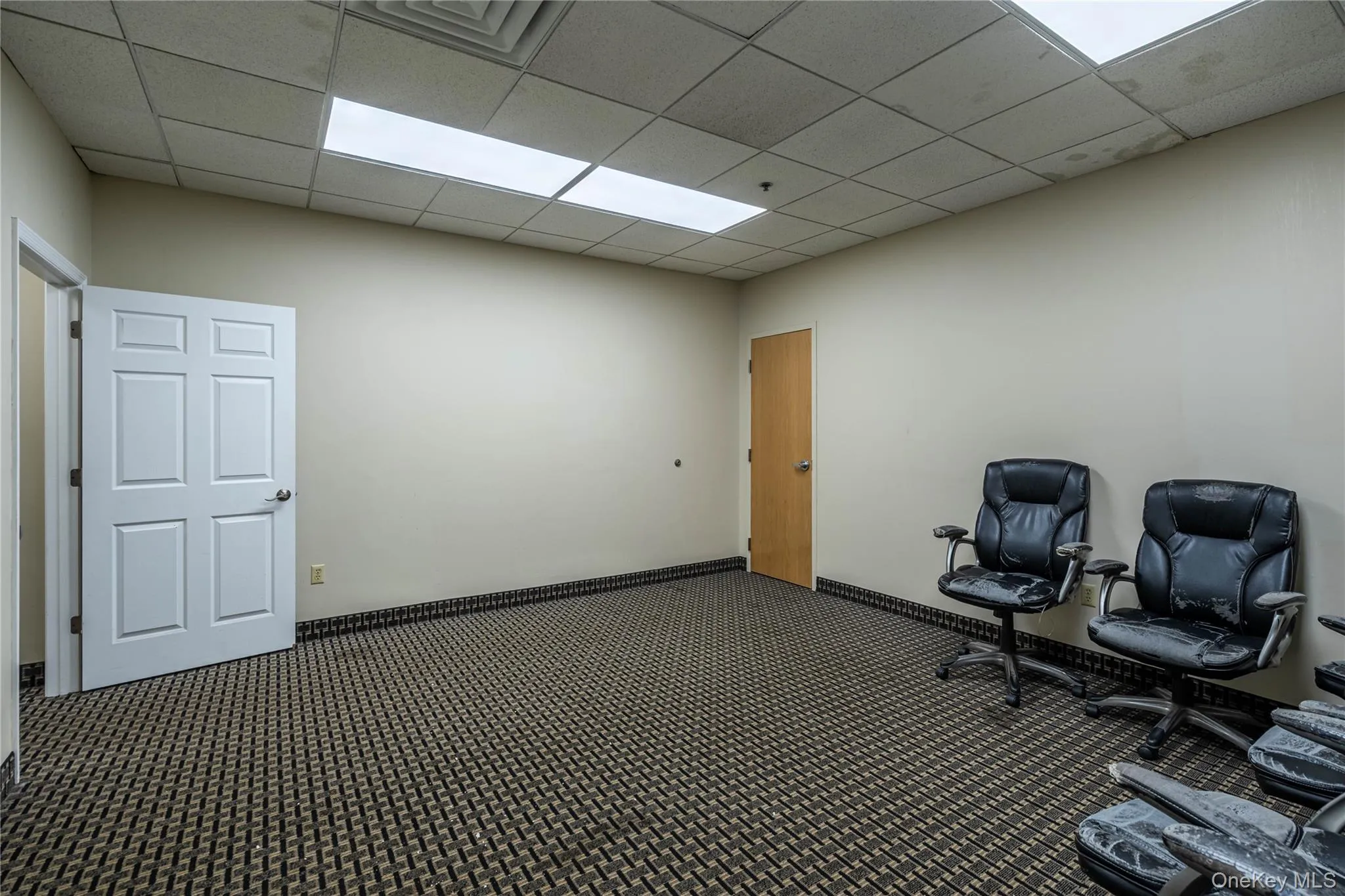 Unfurnished office with a paneled ceiling Unfurnished office with a paneled ceiling