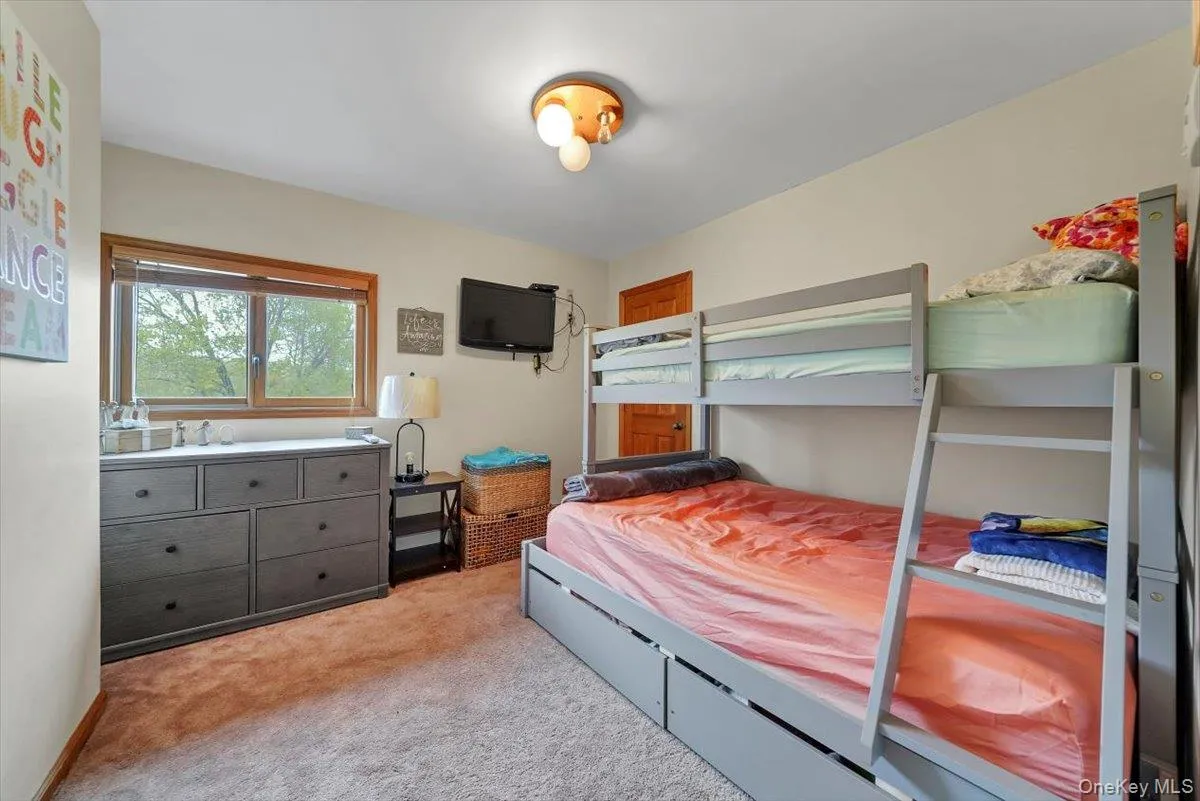 Bedroom with light carpet Bedroom with light carpet