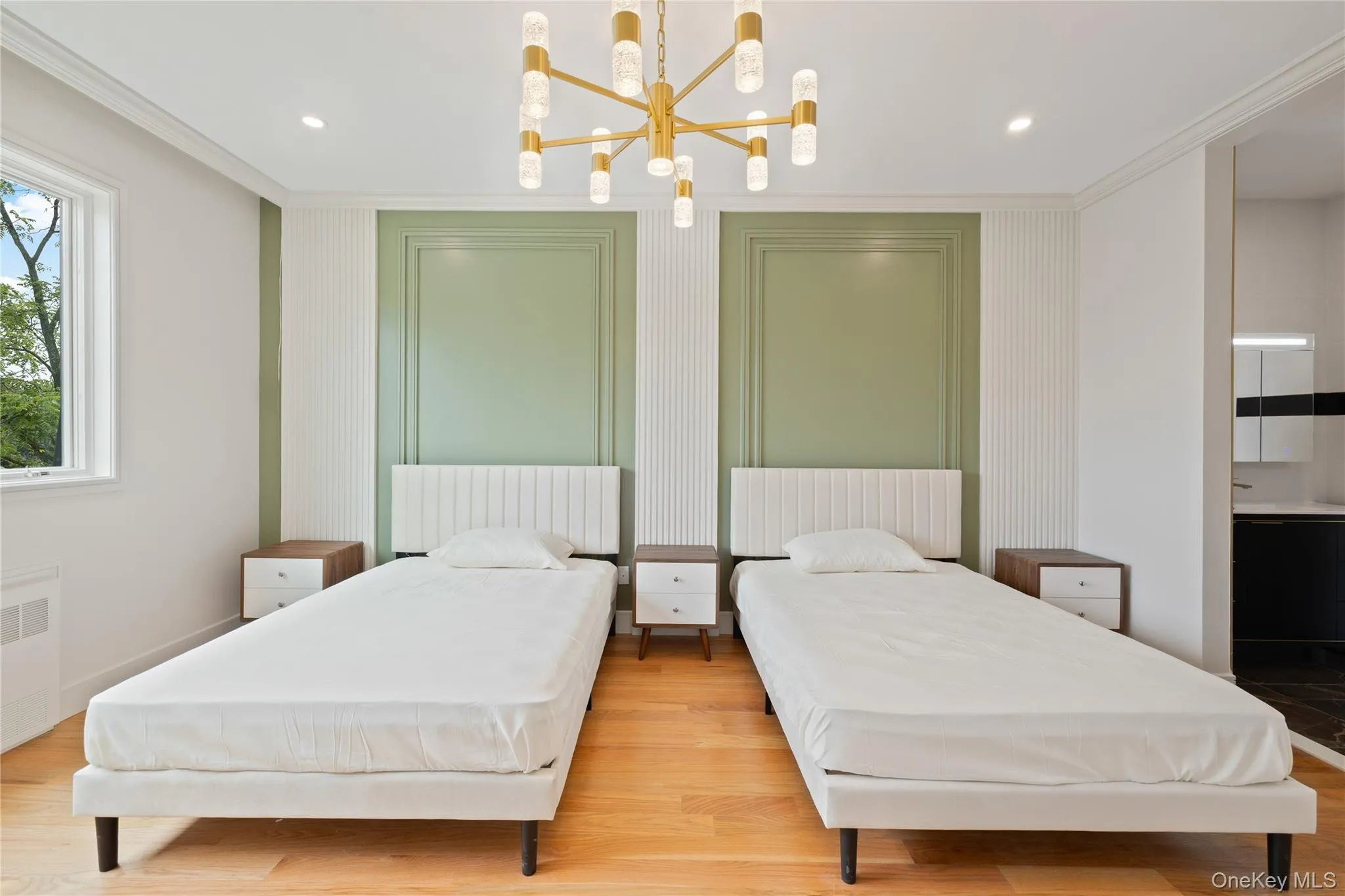 Bedroom with ornamental molding, light wood-type flooring, a chandelier, recessed lighting, and radiator Bedroom with ornamental molding, light wood-type flooring, a chandelier, recessed lighting, and radiator