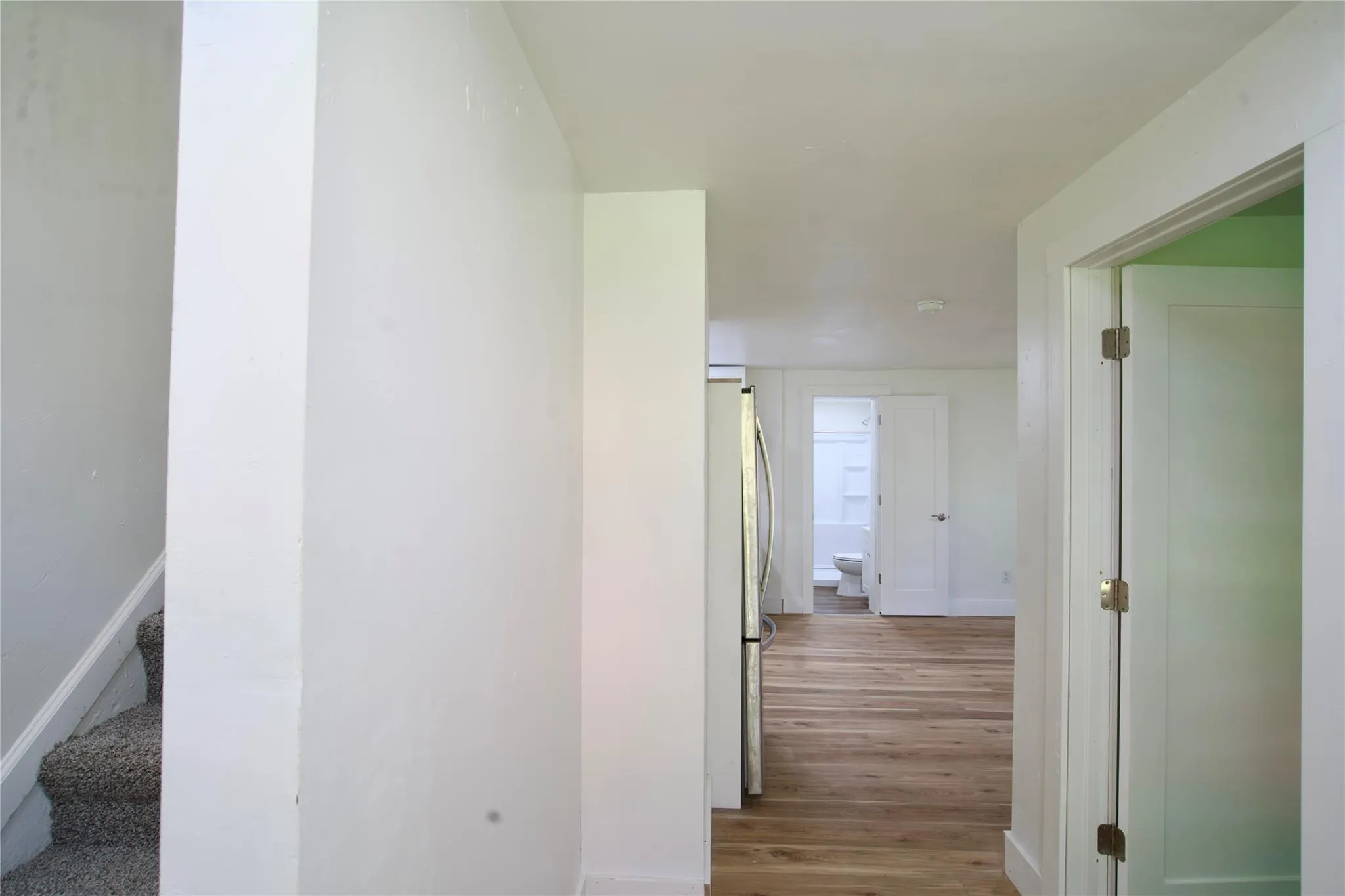 Corridor with wood finished floors and baseboards Corridor with wood finished floors and baseboards