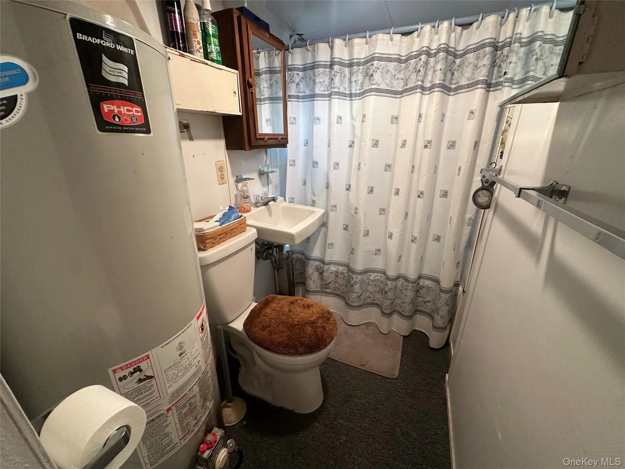 Bathroom houses the water heater Bathroom houses the water heater