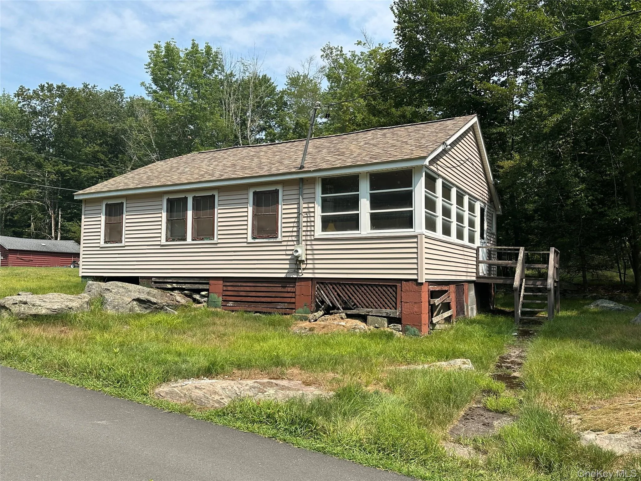Back entry goes to a large 3 season porch with plenty of windows Back entry goes to a large 3 season porch with plenty of windows