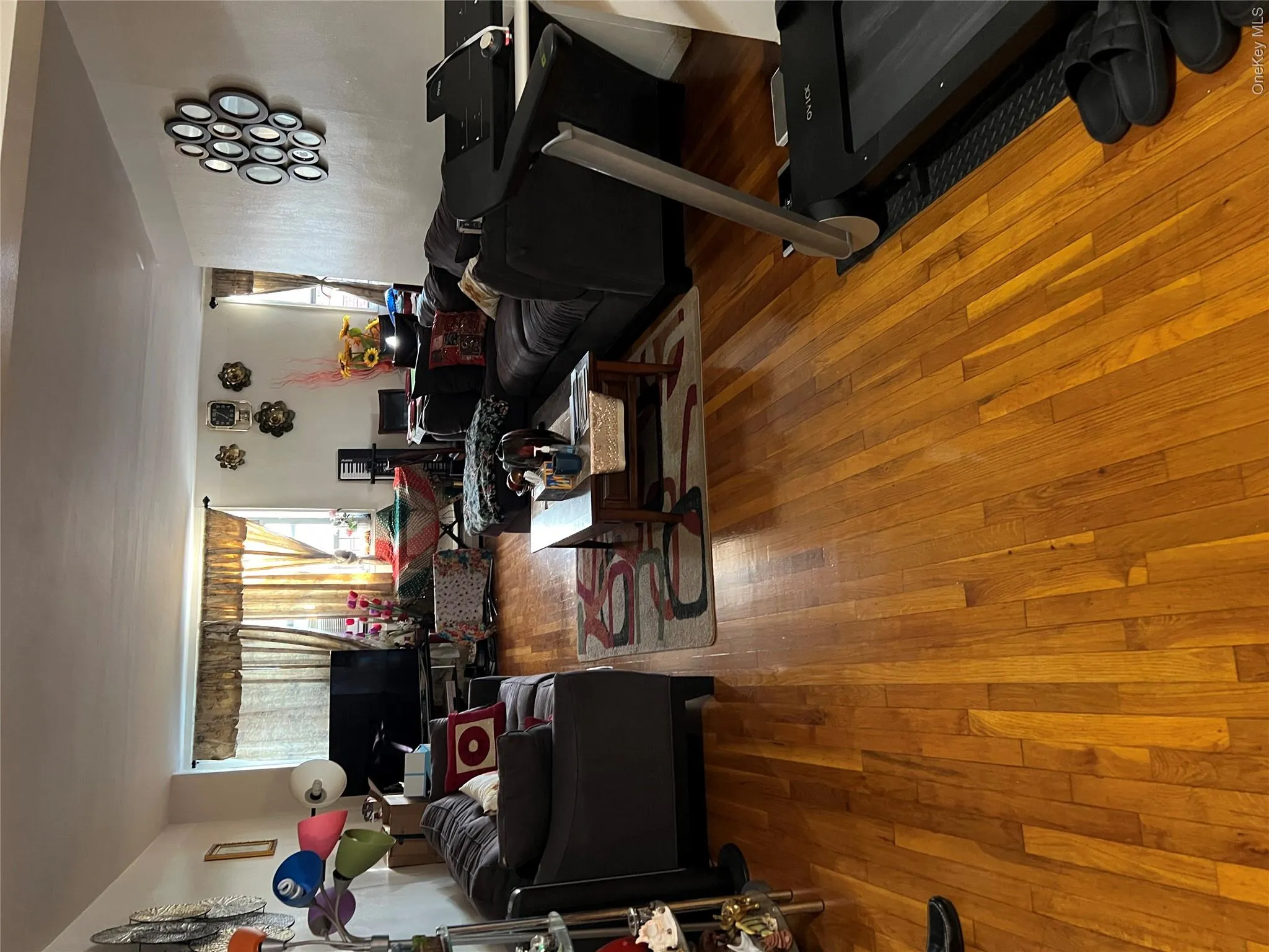Living area with hardwood / wood-style floors Living area with hardwood / wood-style floors