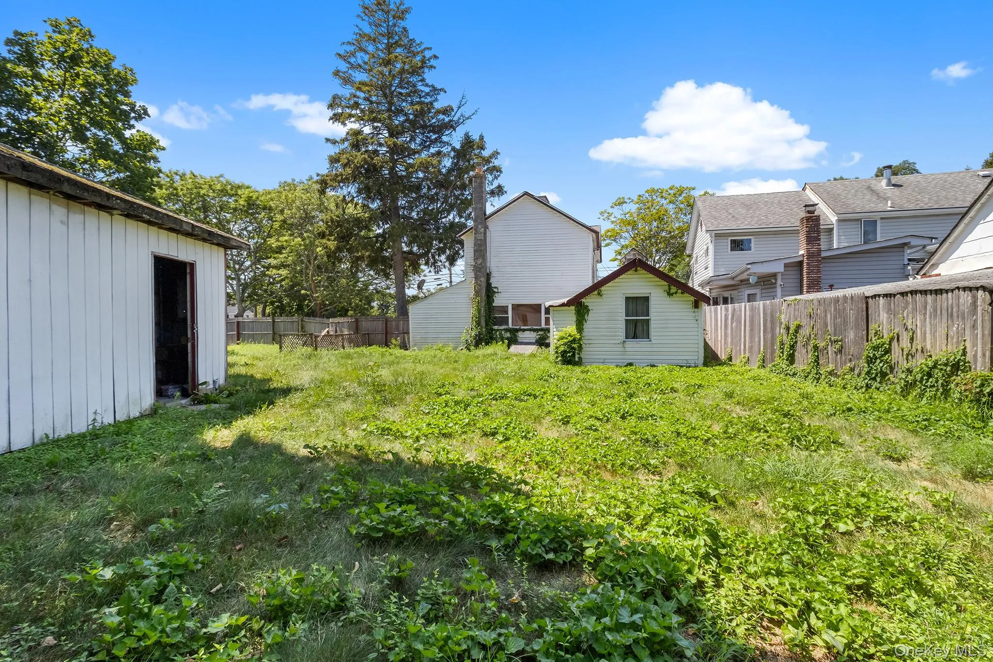 View of yard featuring an outbuilding View of yard featuring an outbuilding