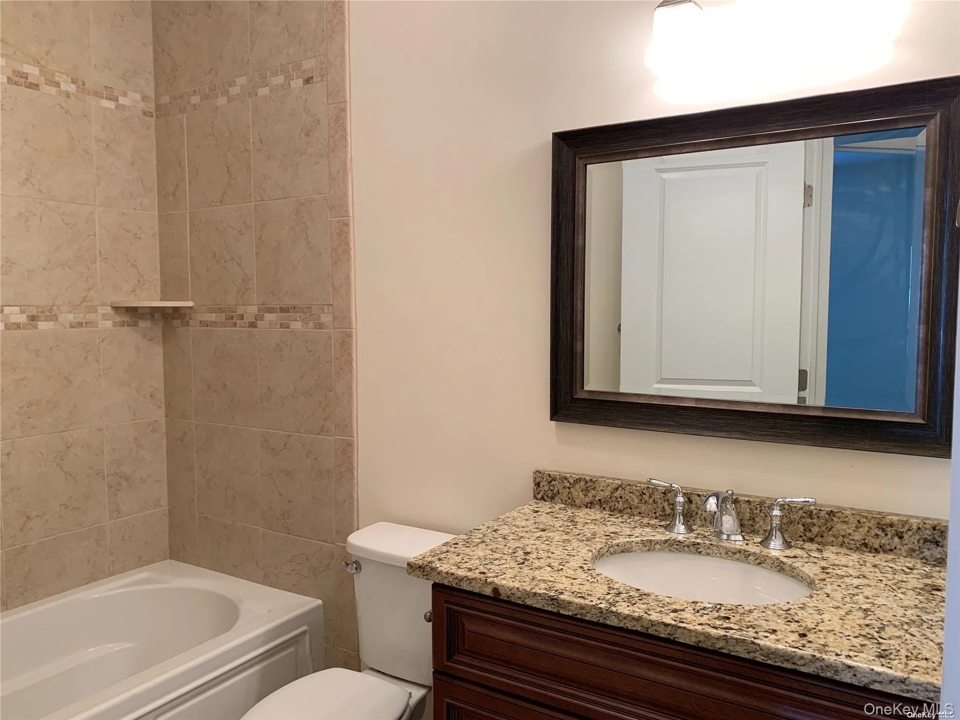 Bathroom with vanity and shower / bathtub combination Bathroom with vanity and shower / bathtub combination