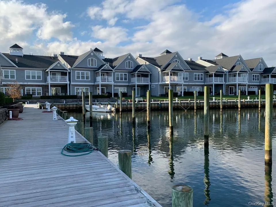Dock area featuring a residential view and a water view Dock area featuring a residential view and a water view