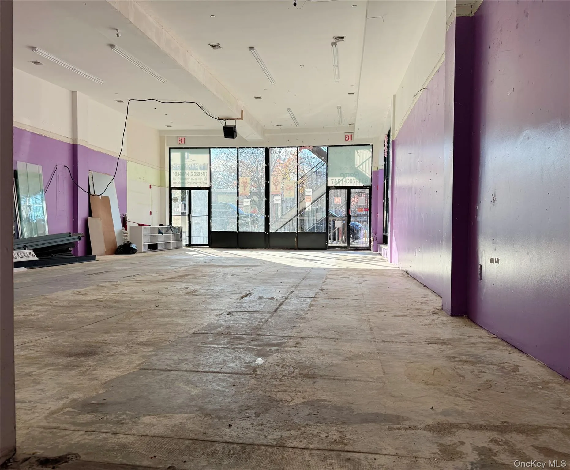 Spare room featuring unfinished concrete floors Spare room featuring unfinished concrete floors