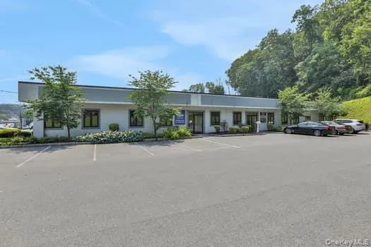 View of property featuring uncovered parking View of property featuring uncovered parking